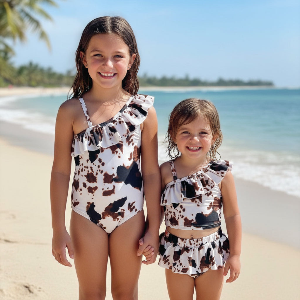 Cow Print Swim Suits are perfect for little cowboys and cowgirls!  Available Styles: Cow Print One-Piece, 2-piece tankini, or boys&#39; Cowprint Shorts.Available in sizes 0-3 months to 8/9 years. Ship FREE with $35+ purchase.