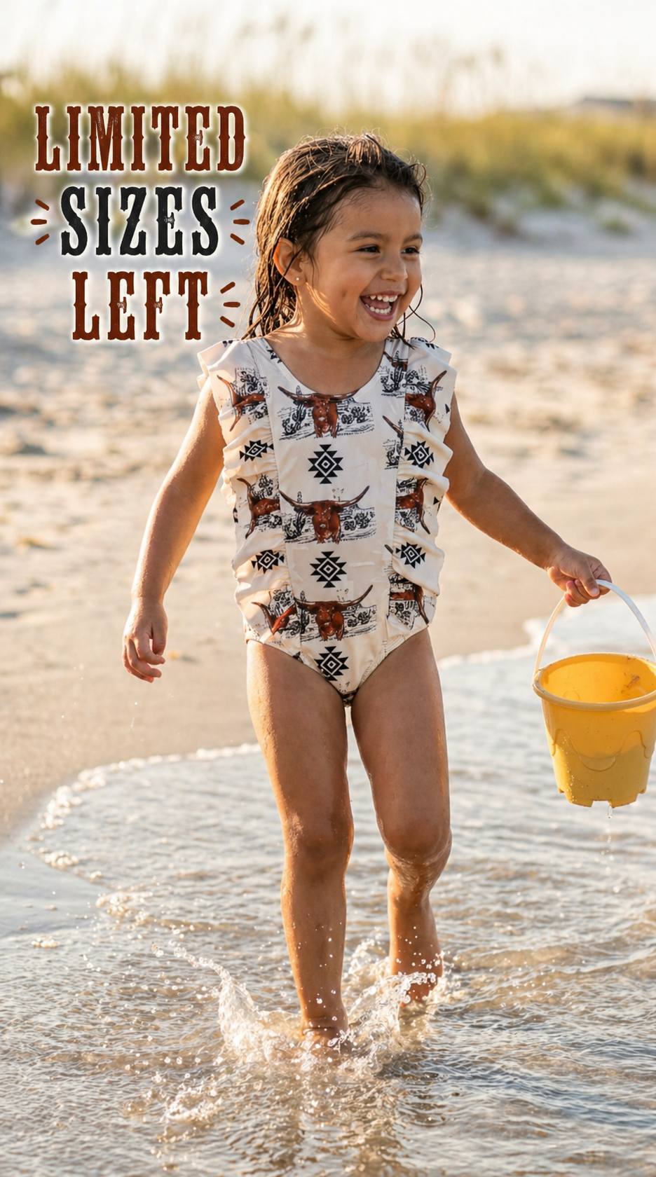 girl running through water wearing razels girls longhorn and aztec one piece swimsuit