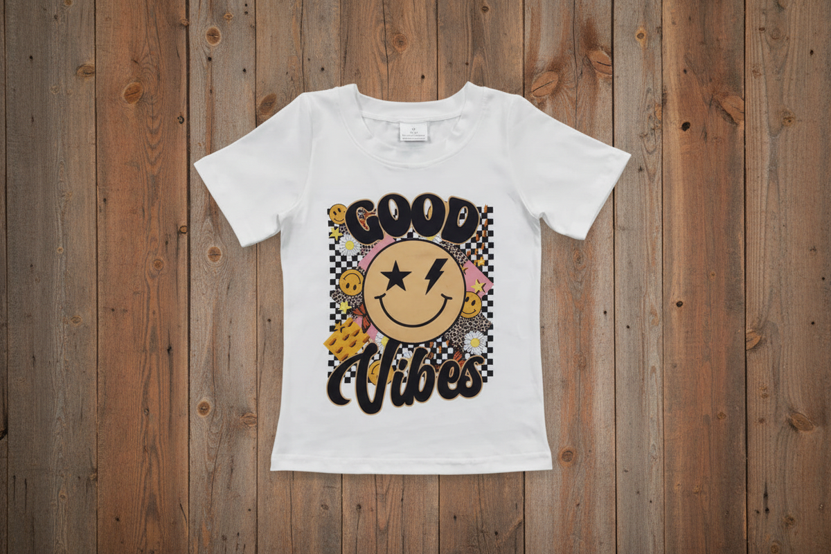 razels good vibes tshirt mixes smiley faces, checkerboard, daisies, stars and more