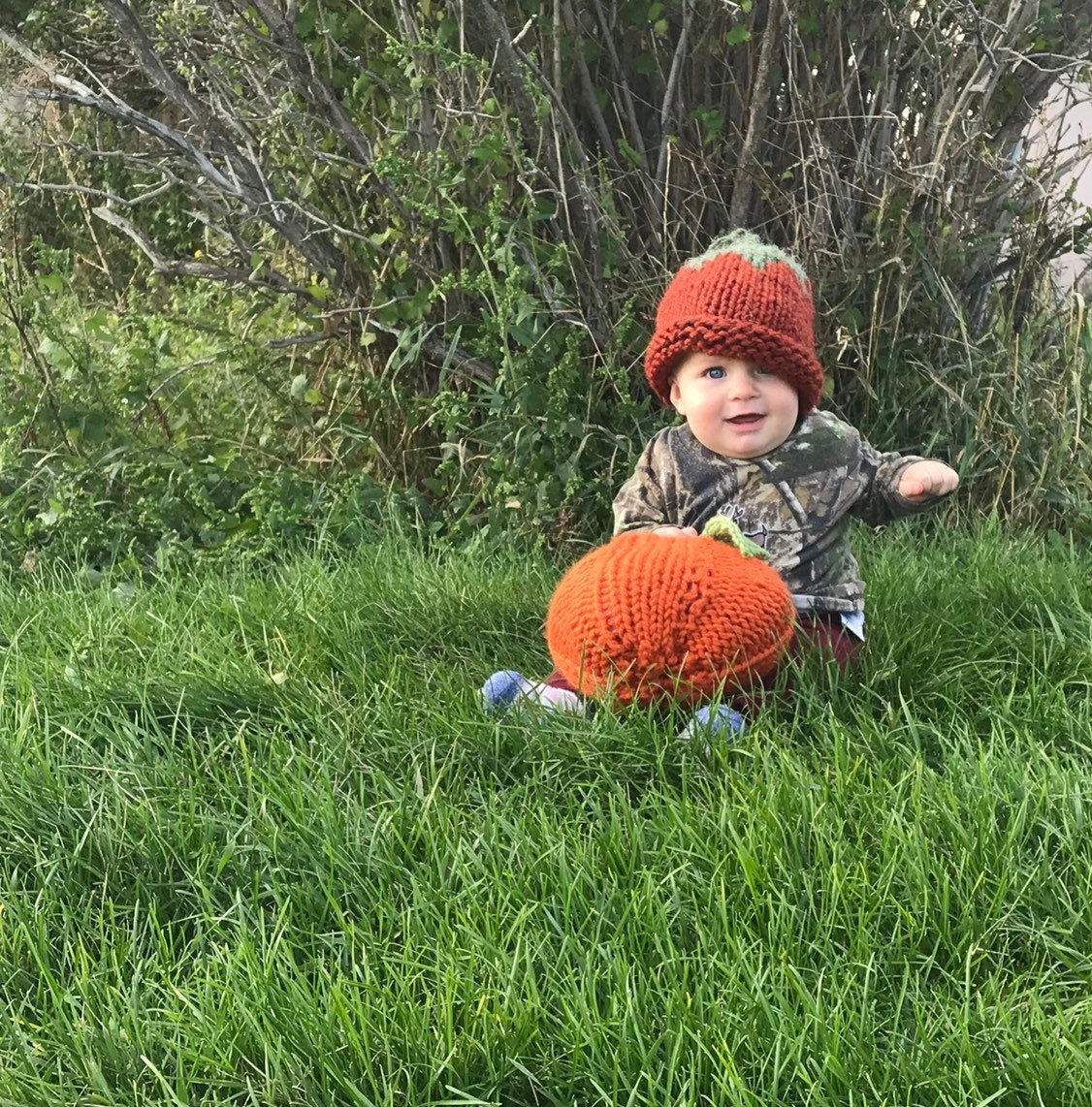 Baby Tell modeling his pumpkin hat