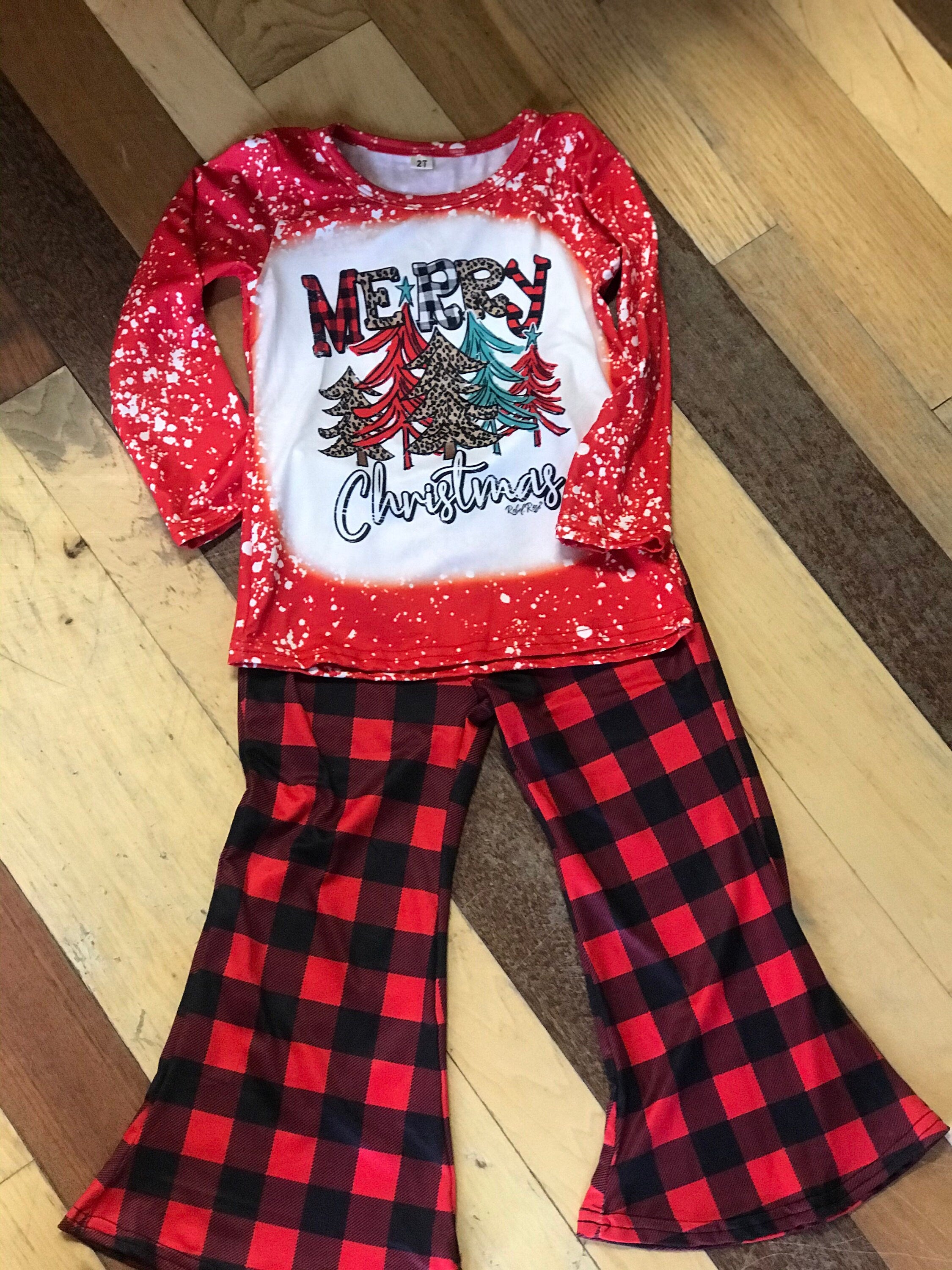 girls christmas outfits featuring red and black checkered buffalo plaid trouser pants and your choice of Merry Christmas or It&#39;s the Most Wonderful Time of the Year Long Sleeve Shirts