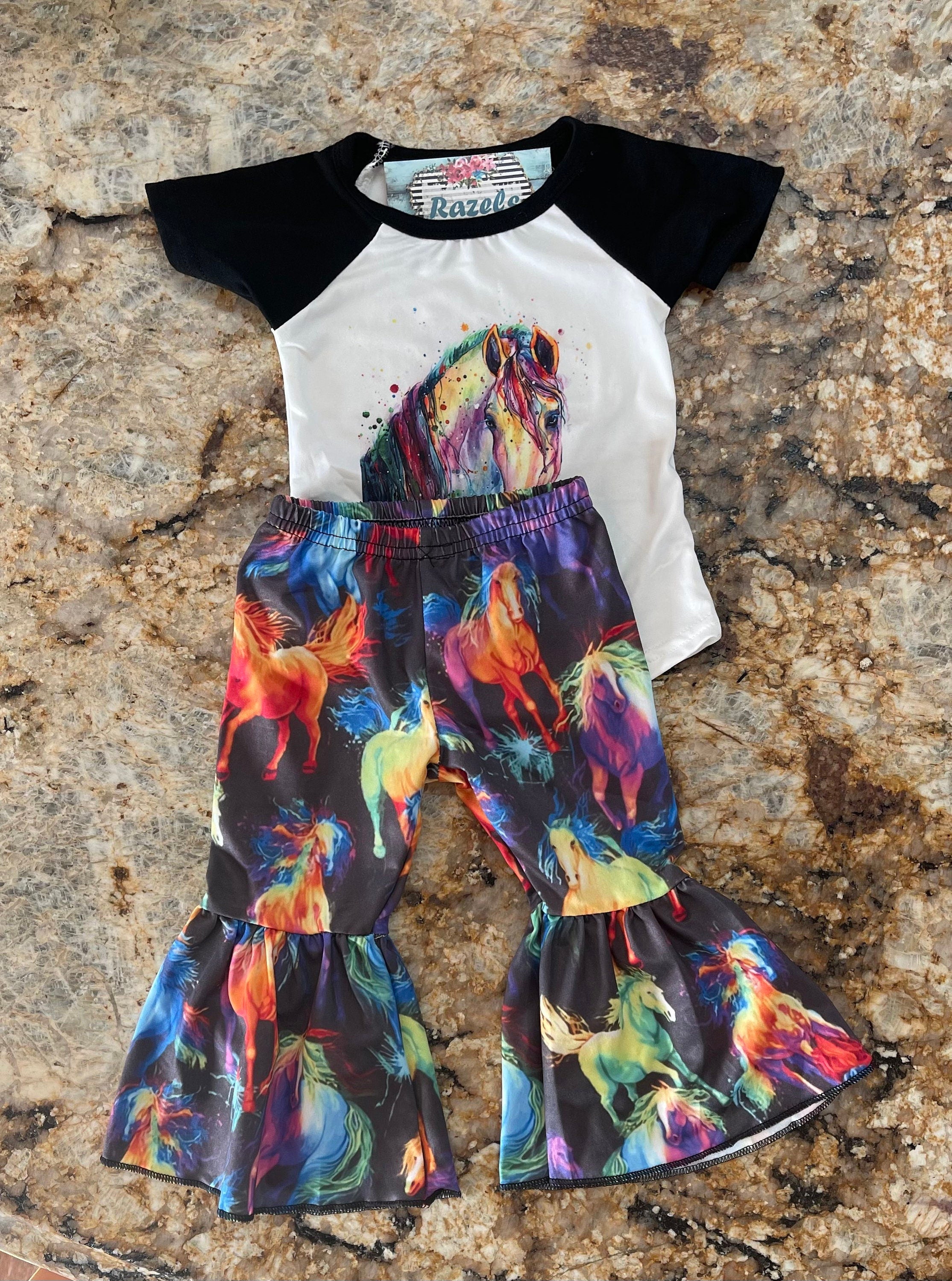 Neon Horse Bell Bottom Outfit -Perfect for Little Cowgirls
bell bottom outfit features a white baseball-style shirt with black sleeves, adorned with a stunning neon horse design, paired with bell-bottom pants showcasing a bold horse print