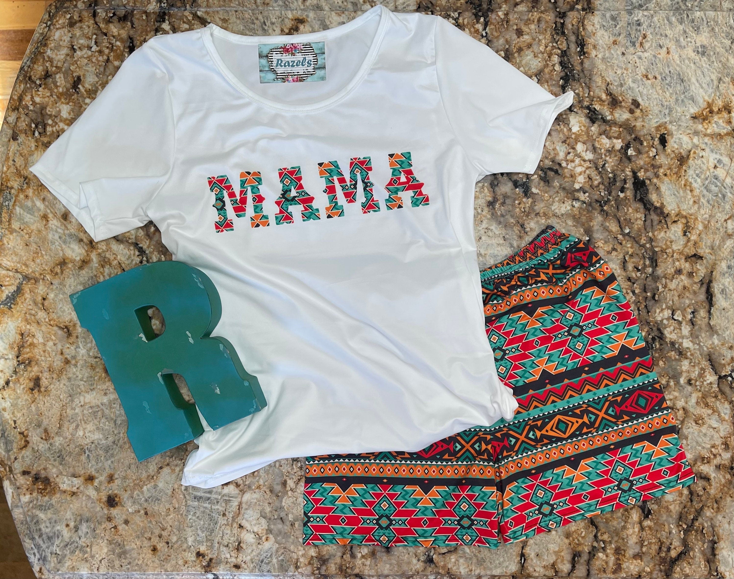 This Cowgirl Mama Pajama Short Set is perfect for lounging in style! Featuring a Mama Shirt and high-rise Aztec biker shorts, it’s comfy, chic, and great for matching with your mini. 💖✨ Shop Razels—FREE U.S. shipping on $35+ orders!