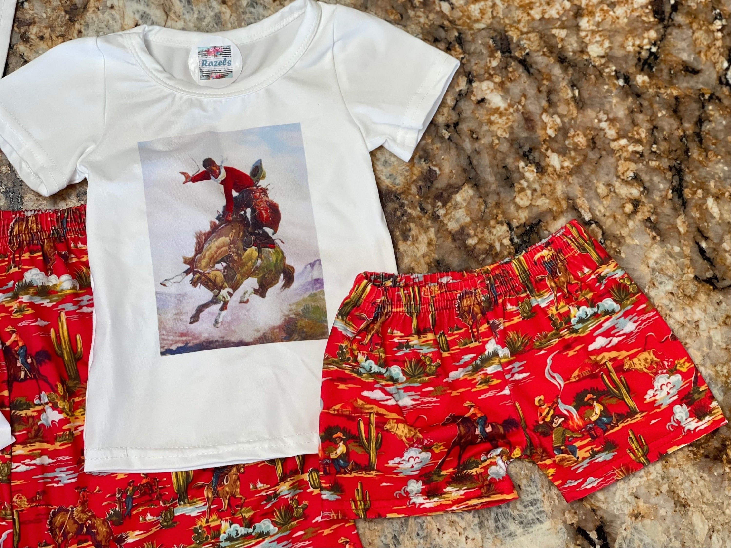 How fun is this Cowboy Shorts & Cowboy T-Shirt set?! 🌵 This Western Lounge Set is everything—perfect for lounging, running errands, or styling up for a day out. The vintage cowboy print gives it that classic Western feel, and the shorts? Absolute perfection! 😍

✨ Why You’ll Love It:
✔ Semi-fitted Cowboy T-Shirt for a flattering look (Medium: 19” underarm to underarm)
✔ Mom and Daughter Matching available—grab the kids&#39; version, too!