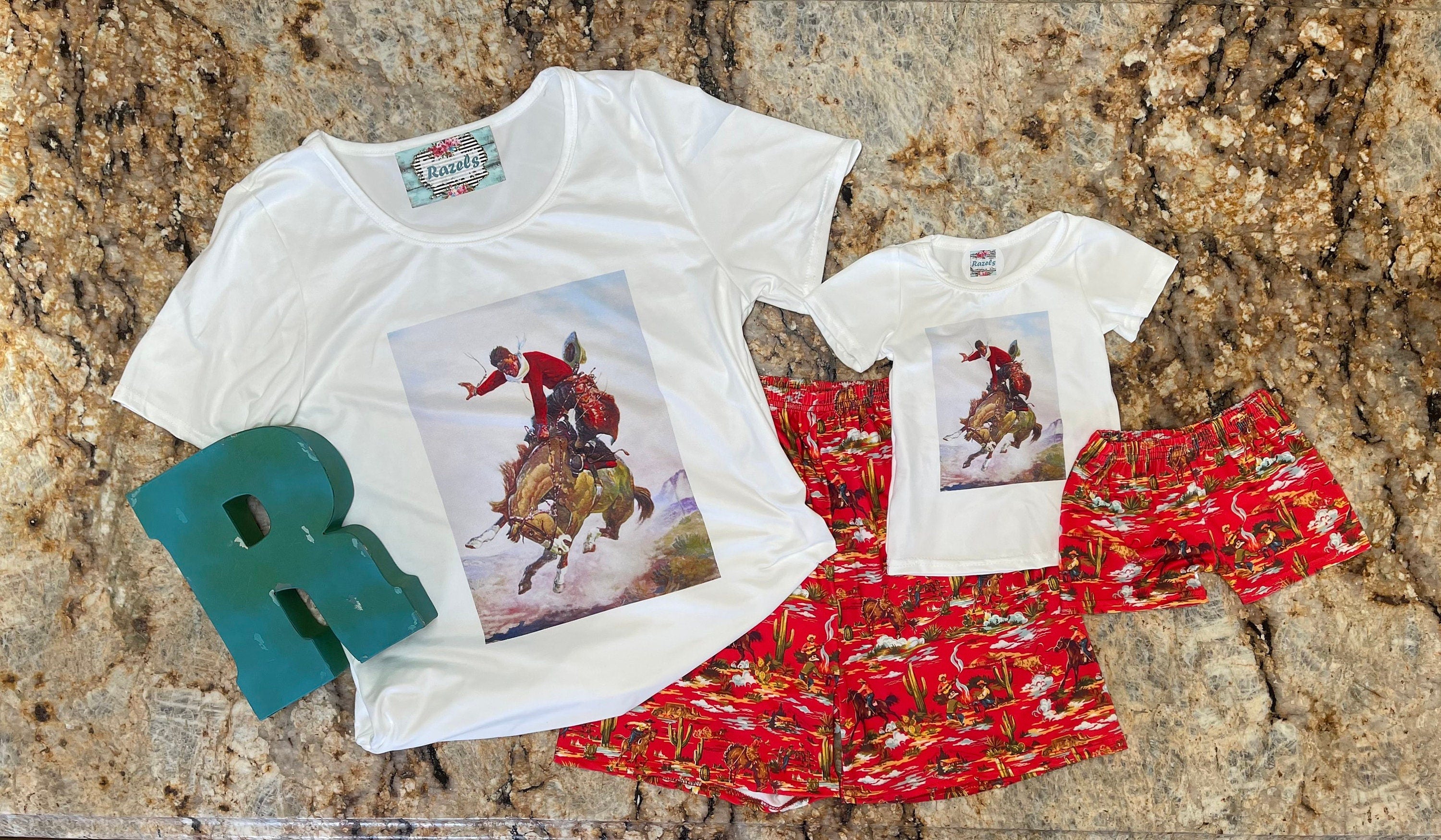 How fun is this Cowboy Shorts & Cowboy T-Shirt set?! 🌵 This Western Lounge Set is everything—perfect for lounging, running errands, or styling up for a day out. The vintage cowboy print gives it that classic Western feel, and the shorts? Absolute perfection! 😍

✨ Why You’ll Love It:
✔ Semi-fitted Cowboy T-Shirt for a flattering look (Medium: 19” underarm to underarm)
✔ Mom and Daughter Matching available—grab the kids&#39; version, too!