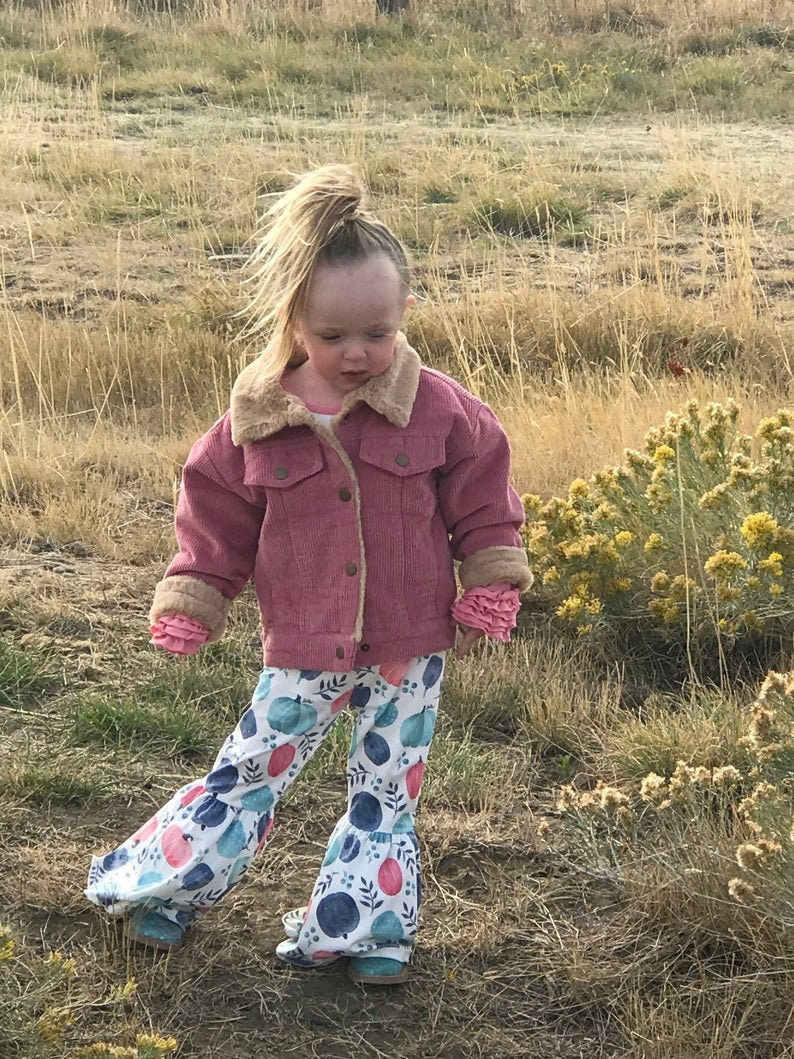 Jernie modeling pumpkin bell bottom outfit and Pink sherpa coat