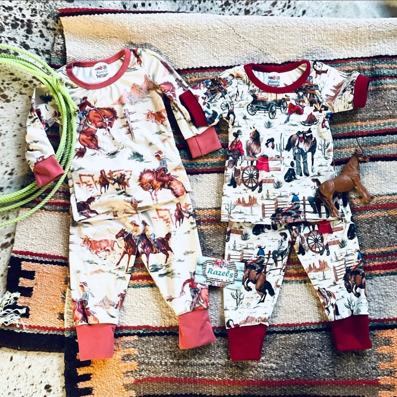 Kids Cowboy Pajamas are a Razels exclusive—featuring a vintage-style Western print with bucking broncos, roping cowboys, and rodeo action galore! 
✓ Vintage Rodeo-Inspired Print – broncs, lassos, and cowboy flair
✓ Super Soft Cotton-Spandex Blend – cozy, stretchy, and perfect for bedtime or play
✓ Unisex Fit – true to size and great for boys and girls alike
✓ Easy Care – machine washable and dryer safe for busy families
✓ Matching Family Options – adult sizes available in a separate listing