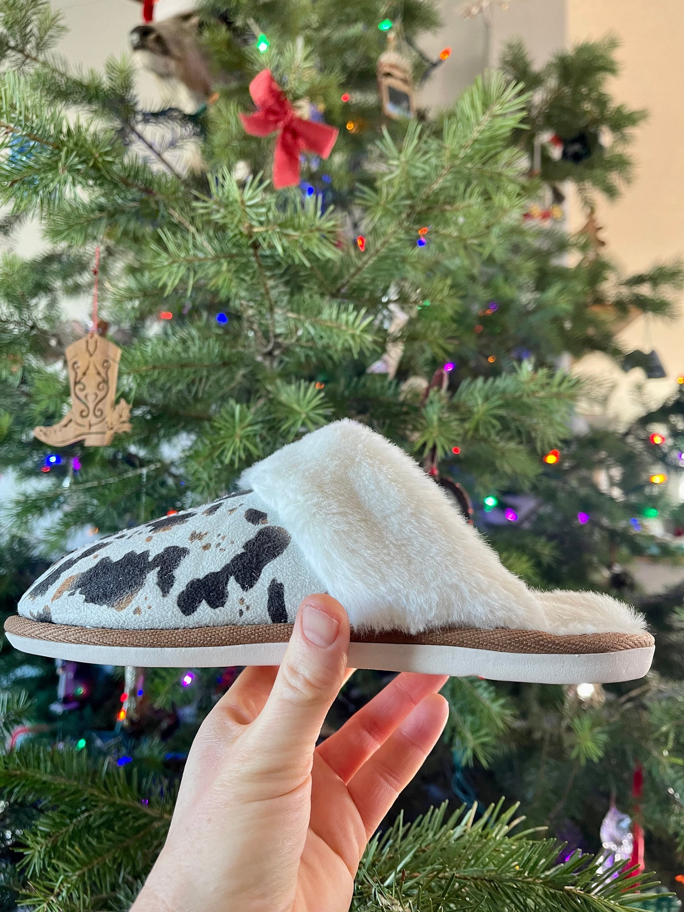 COWGIRL Slippers – The Perfect COWPRINT Slippers for COWGIRL Gifts & GIFTS FOR Country Girls. Cowprint Slippers feature ultra-soft sherpa lining and a durable rubber sole, perfect for lounging at home or quick errands. Ship FREE with $35+ purchase.