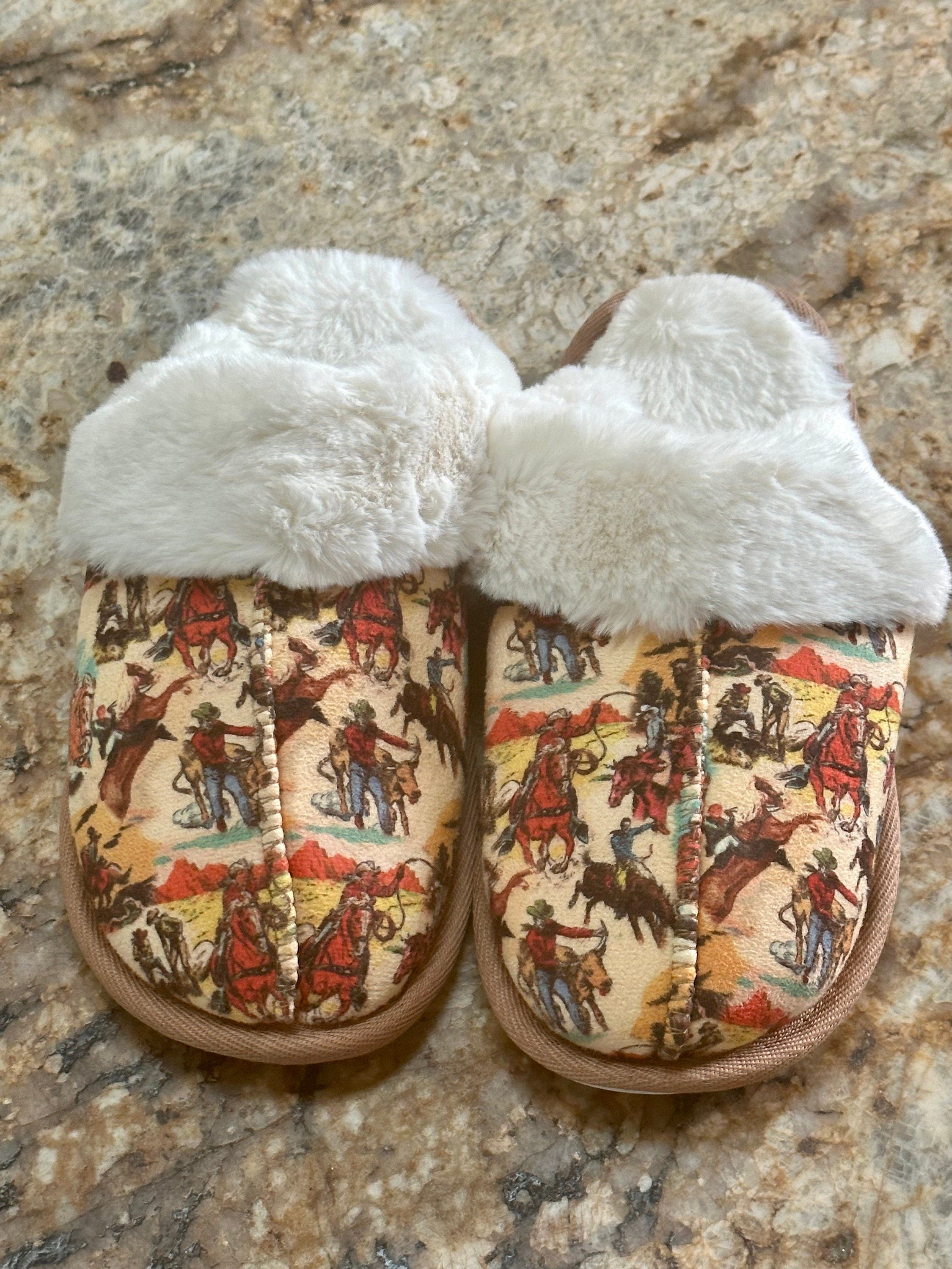 Women&#39;s Plush Cowprint Slippers feature the softest sherpa lining, rubber soles perfect for indoor and outdoor wear, and a fun cowprint pattern. Slippers are also available in vintage cowboy print and cheetah print.