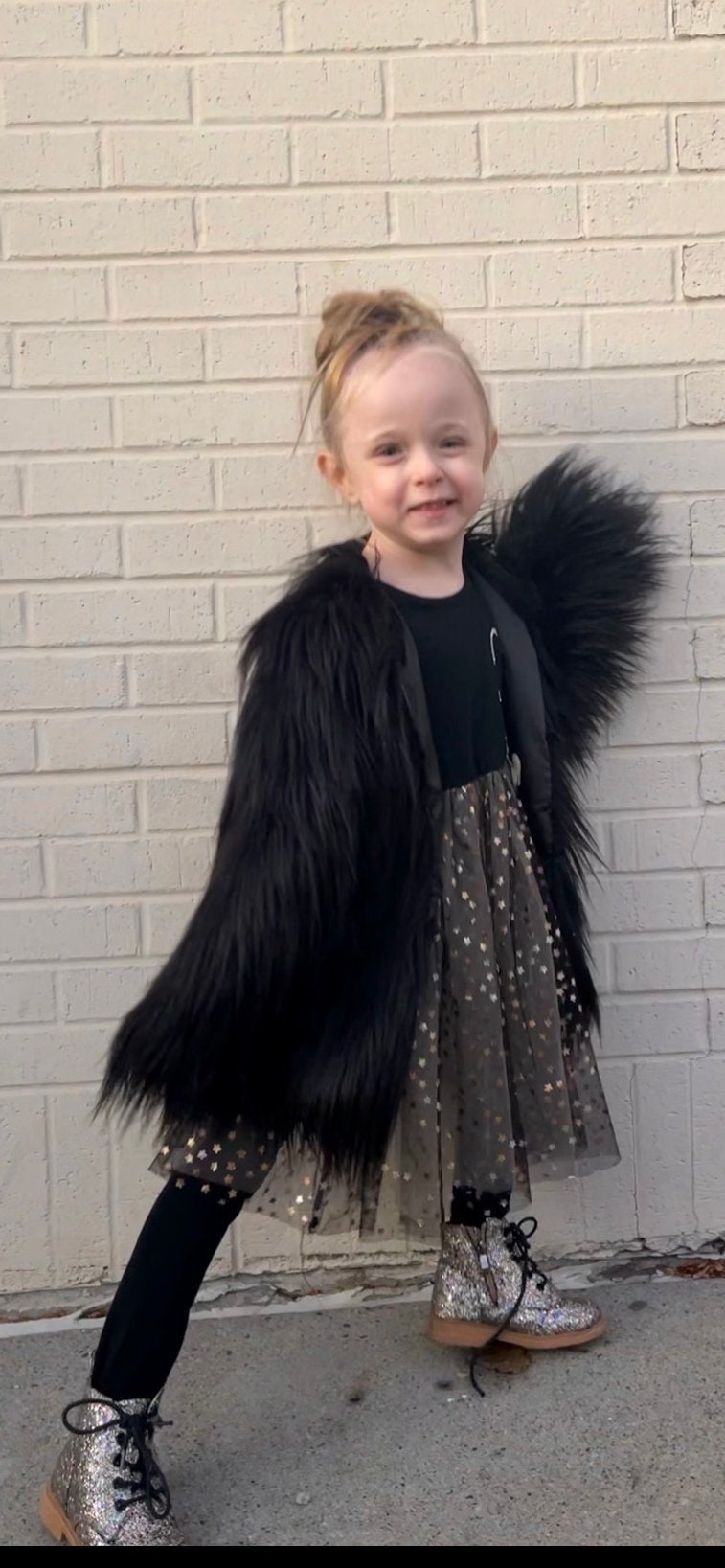 Jernie wearing the black fur coat