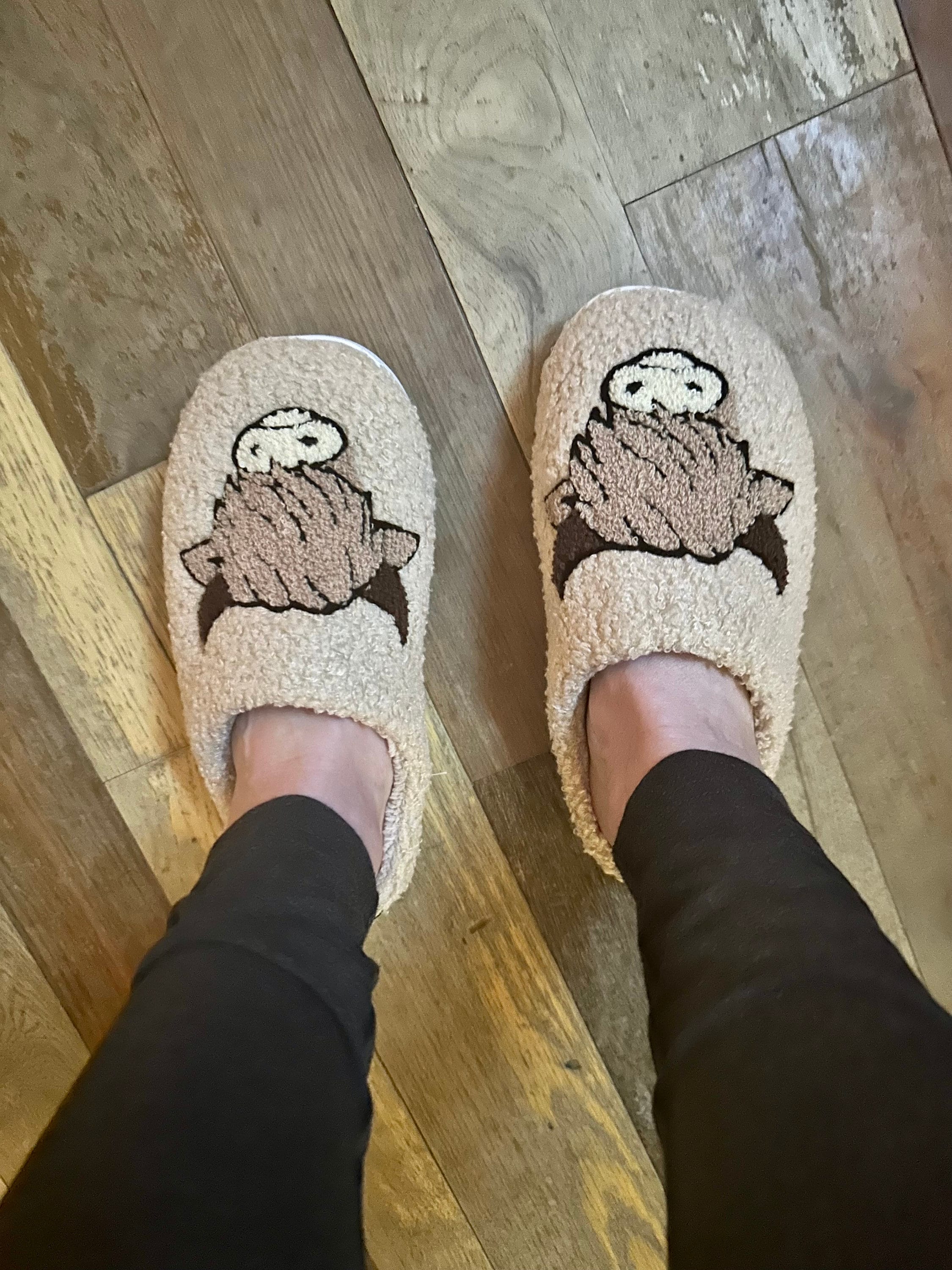 Comfy Scottish Highlander Slippers available in Beige, White and Black. These Western Cow Slippers feature the cutest highlander cow and are so comfy you&#39;ll never take them off! With a rubber sole, you can trek inside and out!