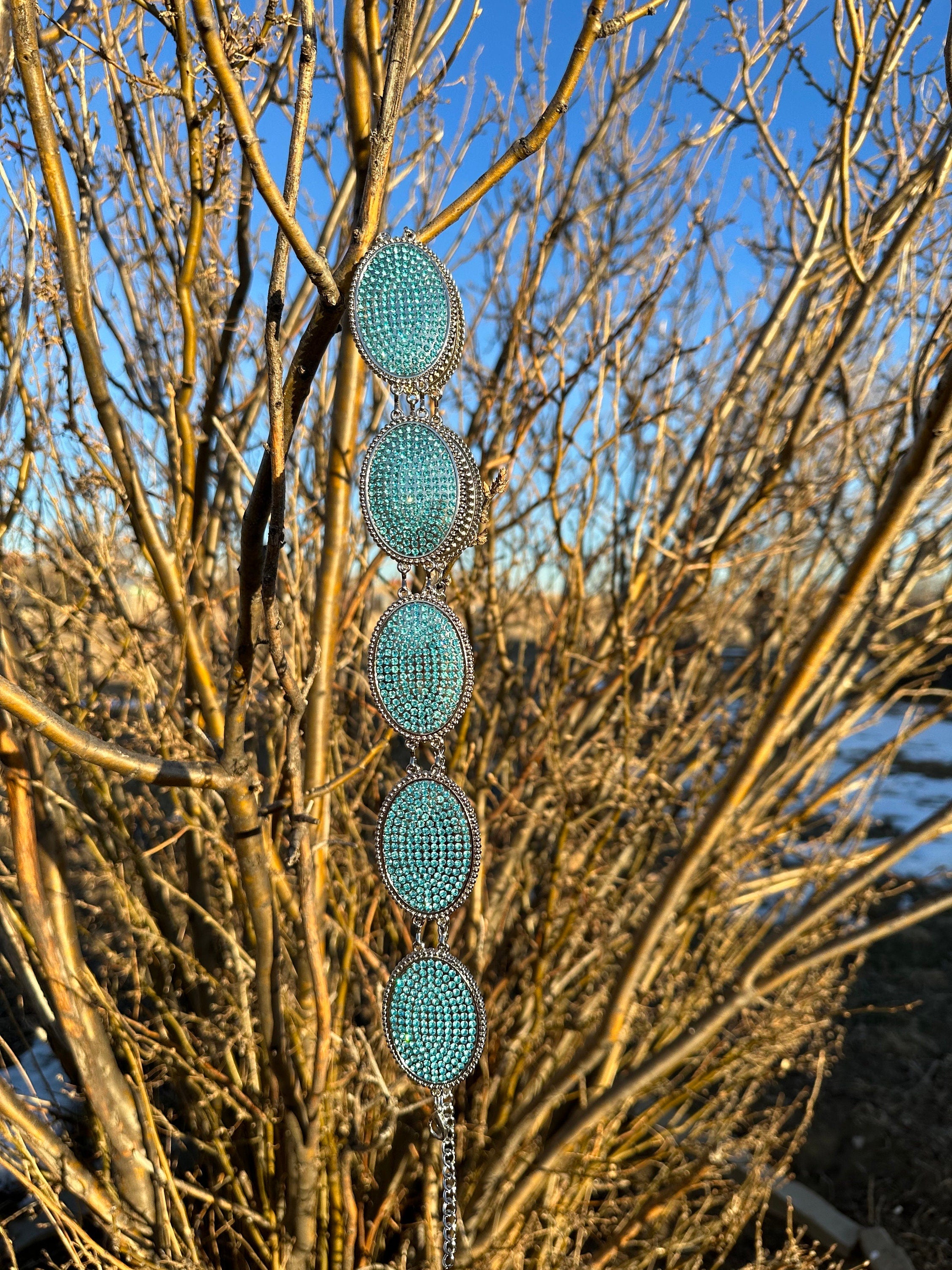 Turquoise Rhinestone Belt for Little Cowgirls! Add a touch of sparkle and Western charm to your little cowgirl’s wardrobe with this fabulous turquoise rhinestone belt! Belt s adjustable 
and makes a great gift!