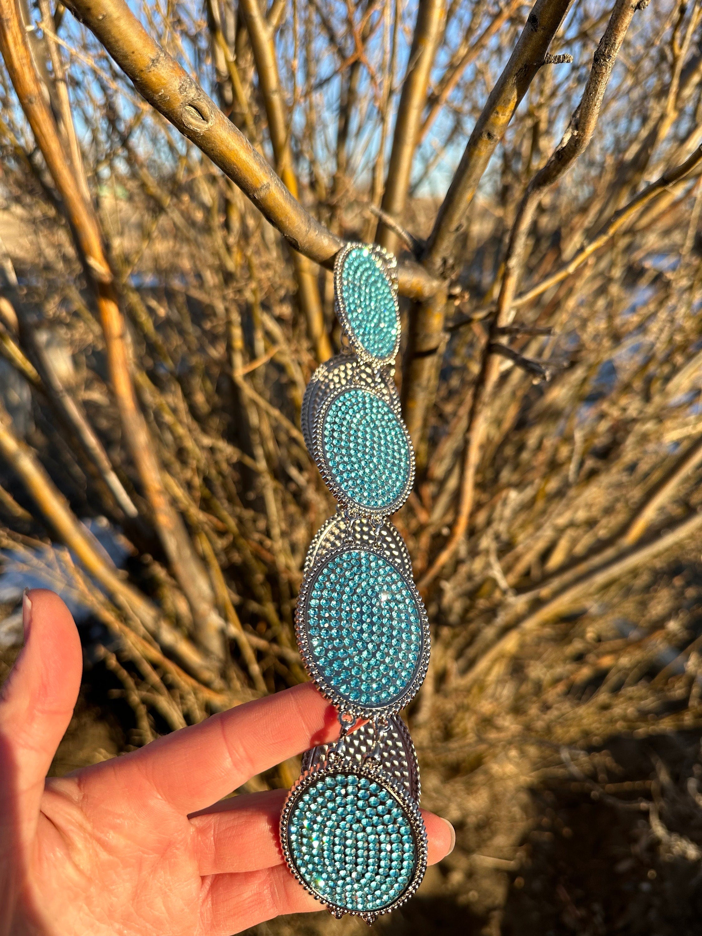 Turquoise Rhinestone Belt for Little Cowgirls! Add a touch of sparkle and Western charm to your little cowgirl’s wardrobe with this fabulous turquoise rhinestone belt! Belt s adjustable 
and makes a great gift!