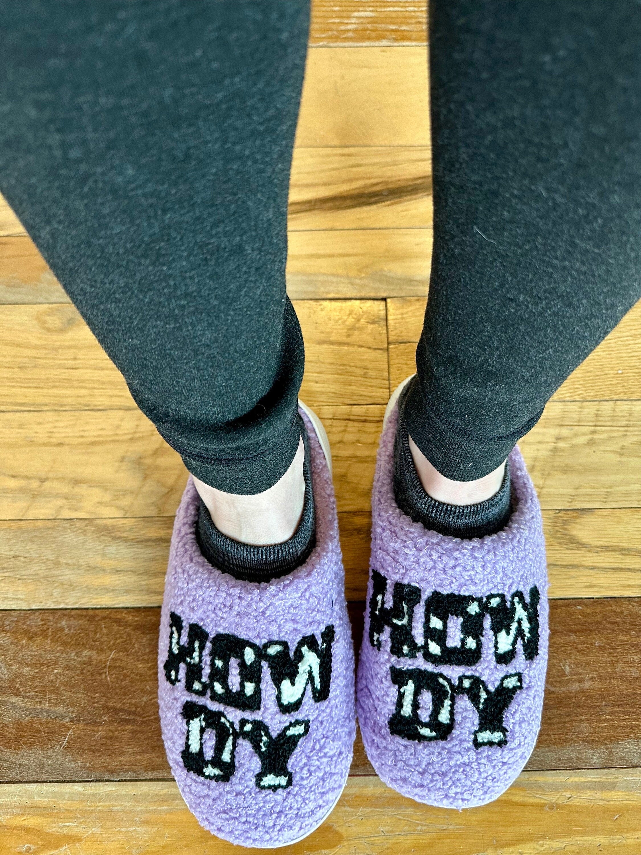 Western Cowgirl Slippers – Fall-Ready, Back-to-School Comfy Must-Haves! 
Cowprint Howdy Slippers!
With a playful cowprint, rich purple hue, and cheerful “Howdy” design, they’re a fun and functional gift for cowgirls of all ages—college students, Western mamas, or just anyone who loves a little yeehaw with their loungewear. slippers ship FREE