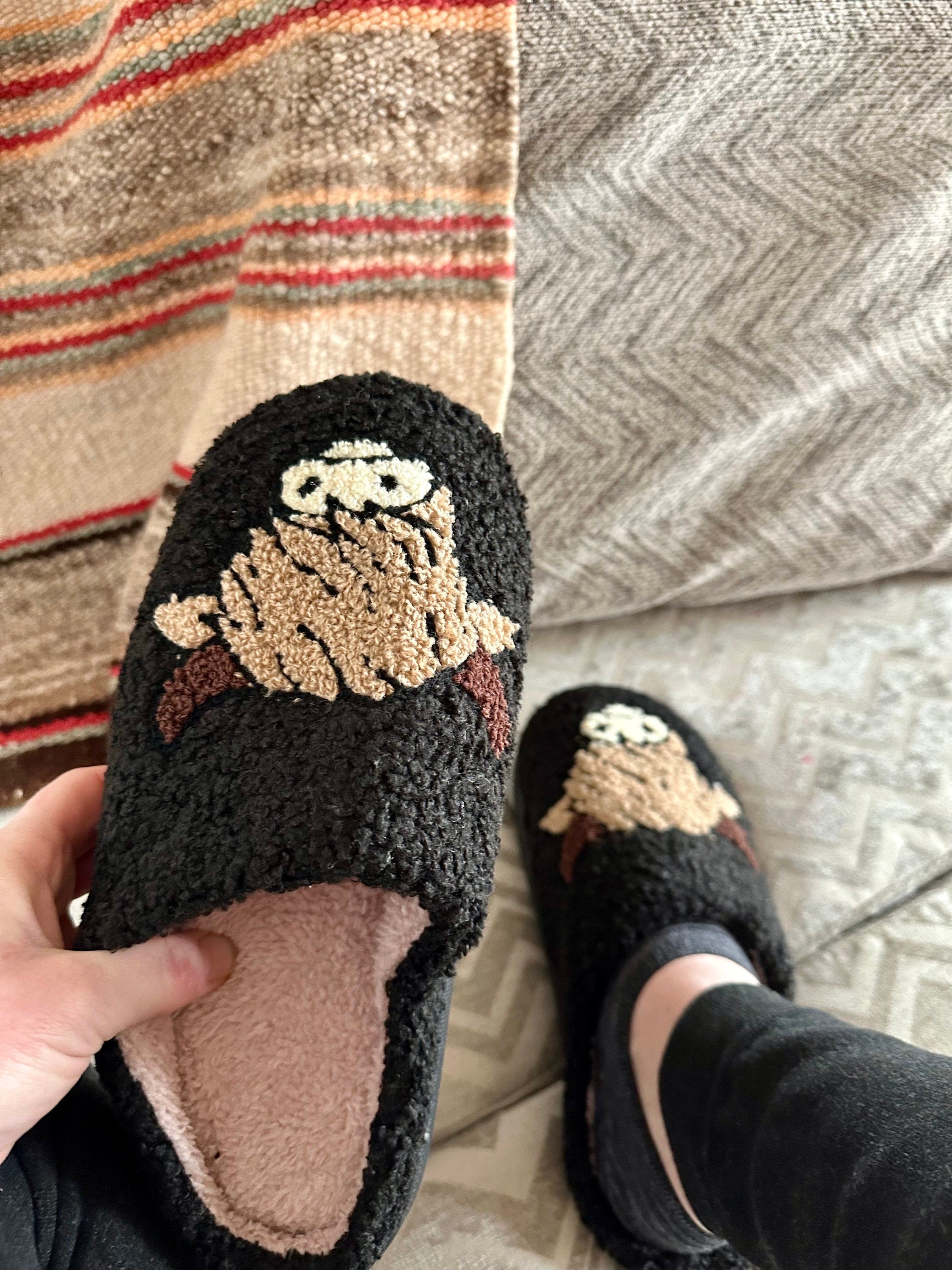 Comfy Scottish Highlander Slippers available in Beige, White and Black. These Western Cow Slippers feature the cutest highlander cow and are so comfy you&#39;ll never take them off! With a rubber sole, you can trek inside and out!