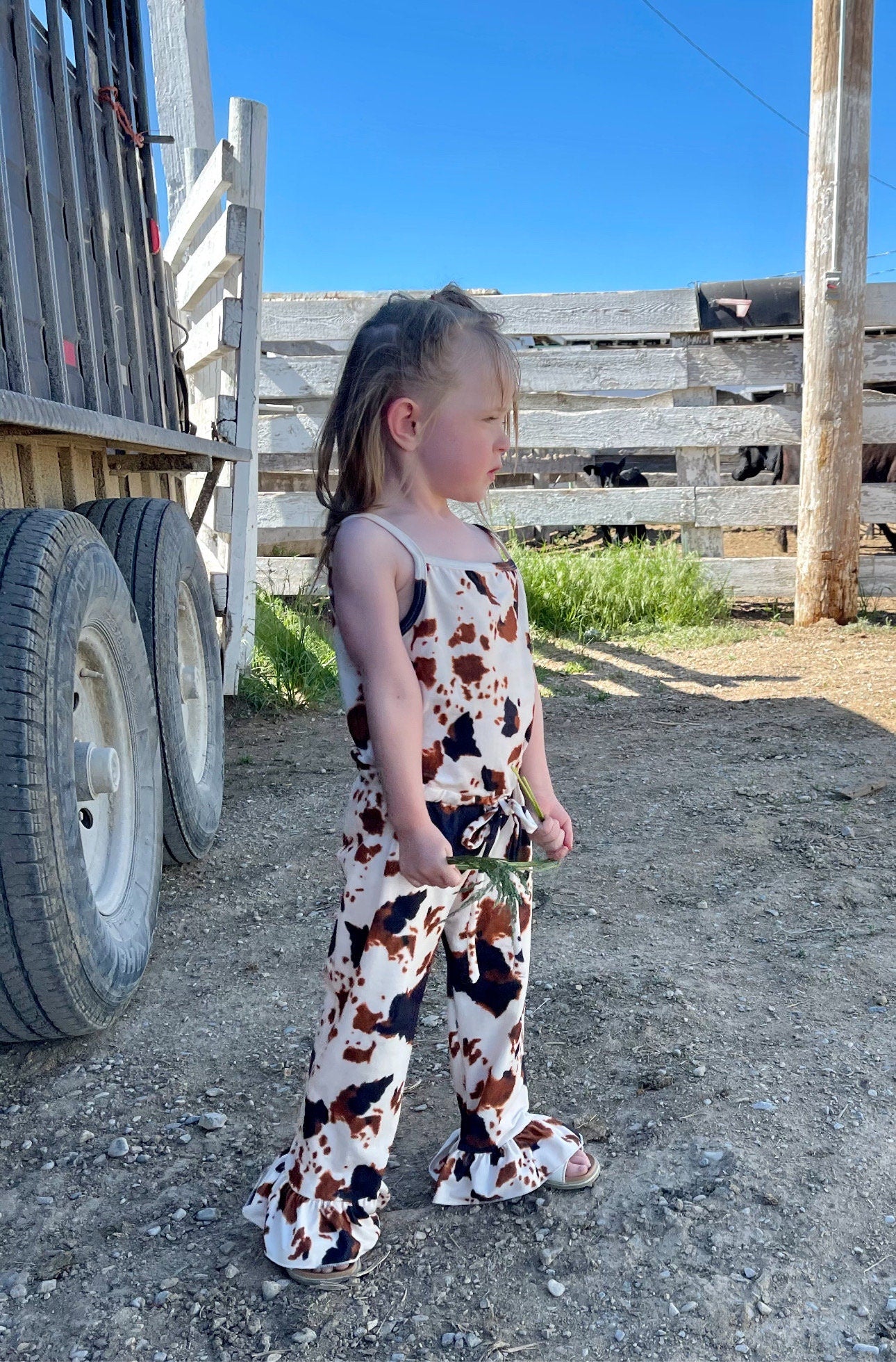 Adorable Cow Print Jumpsuit Romper for girls! Soft cotton/spandex blend, comfy slip-on style with elastic waist, machine washable. Available from 0/3 months to 8/9. Ships today from Montana! Perfect COWGIRL ROMPER for all day and special occasions.