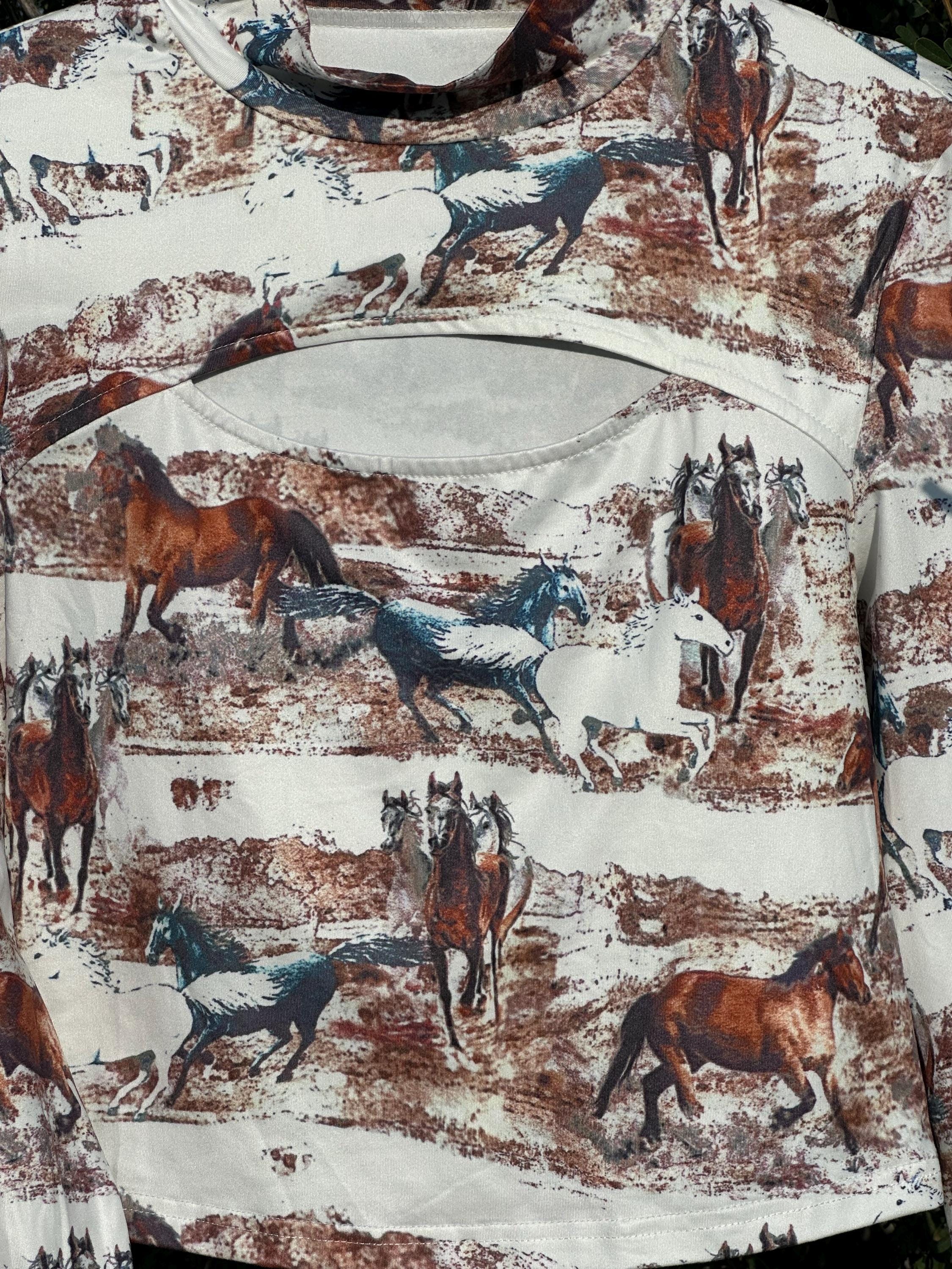 Introducing the Western Wild Horse Shirt. Make a bold impression with this slim-fit top, combining a flattering silhouette with eye-catching details. Featuring a striking wild horse design, a stylish front cut-out detail, and a chic high-neck design.