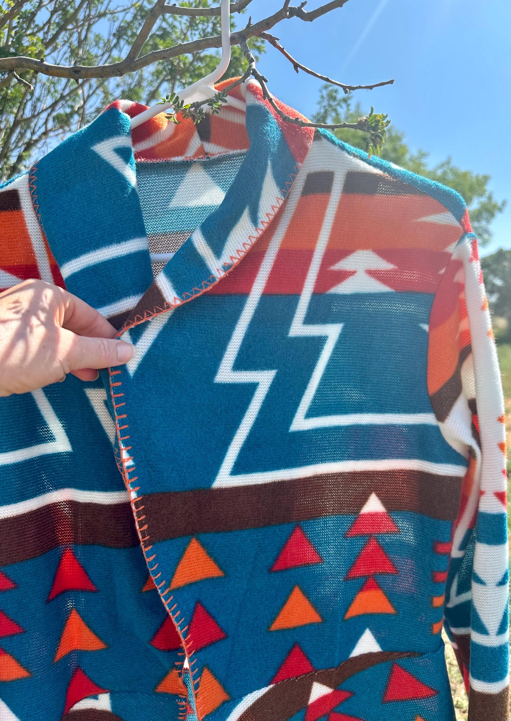 Fall Must-Have: Western Cardigan Jacket

Stand out this season with our Western Cardigan Jacket in bold turquoise and orange! Lightweight, flowy, and packed with style, it’s the perfect layering piece for cool fall days.