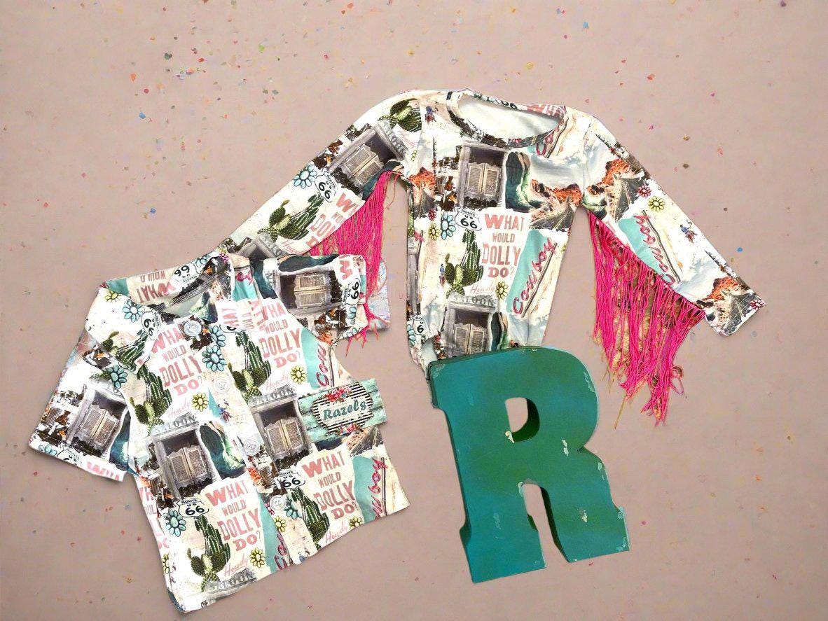 Get ready to dazzle with our adorable What Would Dolly Do? Cowgirl Shirt & Fringe Bodysuit. 
 The button-up shirt features a bold Western-inspired design, while the fringe bodysuit adds flair in vibrant pink. Shop Razels for Girls Western Wear