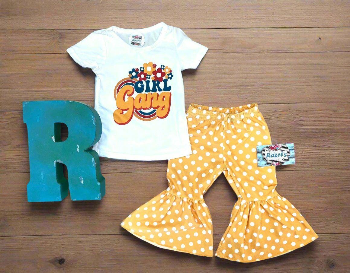 Girl Gang Shirt and Yellow Polka Dot Bell Bottom Outfit – Retro Floral Vibes for Girls!  🌼💪🏽

This fun, bright Polka Dot Bell Bottom outfit is perfect for your little fashionista! I love the retro floral vibe, and what could be more fun than yellow polka dot bell bottoms? This adorable outfit is ready for sunshine and warm weather! 🌞 Or, pair it with a denim jacket for those cooler days, especially if you live in Montana like us! 😉🤠Ships FREE with $35+ purchase from MONTANA.