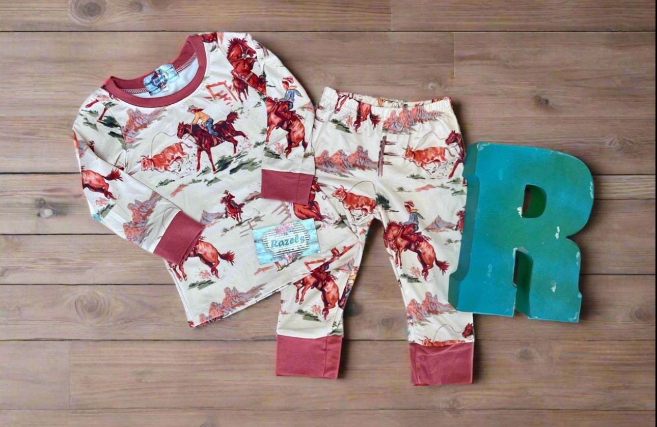 Saddle up with our exclusive Cowboy Pajamas featuring retro bucking broncs, roping steers, and steer wrestling! They’re comfy, stretchy, and true to size. Perfect for little wranglers and the whole family! Shop Razels for matching Western family PJs!