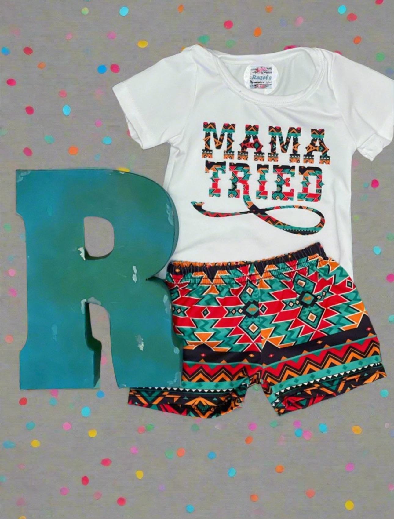 Oh my goodness, this little set is Western perfection! 🤩 Our &quot;Mama Tried&quot; short set for kids features a bold Aztec-inspired graphic and matching comfy shorts—made for the wild-at-heart little gals who keep us laughing (and on our toes!).
✓ &quot;Mama Tried&quot; Aztec design on a soft cotton blend
✓ Matching print shorts with an elastic waistband
✓ Great for cowgirl cuties, rodeo babes, and Western wildflowers
✓ Pair with the matching Mama Set (sold separately)