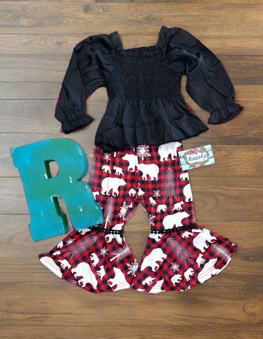 Embrace the holiday cheer with this festive Christmas outfit, perfect for your little one’s seasonal celebrations! 🎄❄

This adorable set features:
✓ A soft black blouse for a classic holiday touch
✓ Red buffalo plaid bell bottoms decorated with white bears, trees & snowflakes for cozy festive flair

✨ Available Sizes: 12/18 months, 18/24 months, 2/3T, 3/4T

Whether it’s a visit with Santa, family photos, or holiday parties, this outfit brings comfort and Christmas spirit in one!