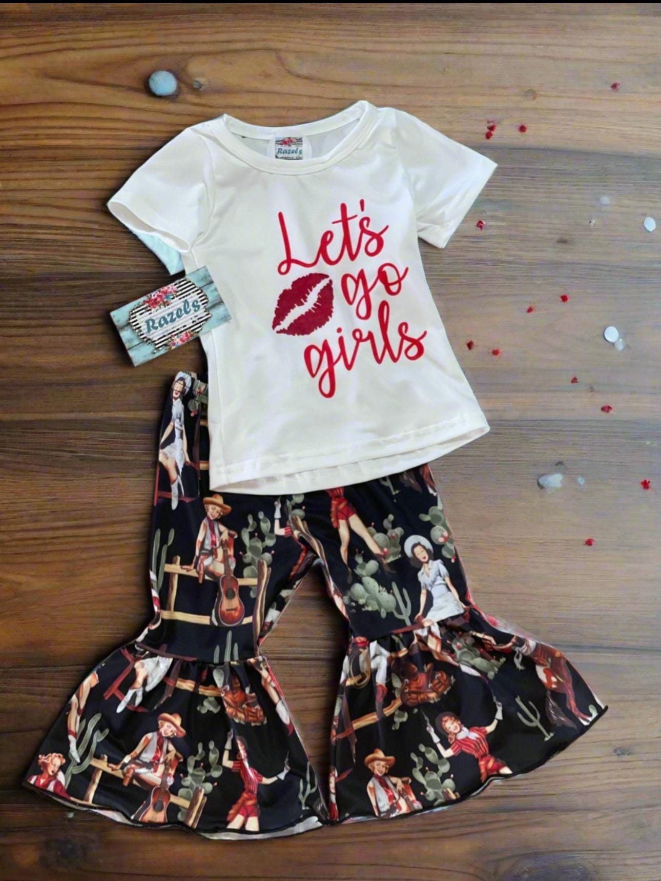 Let’s Go Girls! 💖 This adorable Western outfit is made for your bold little cowgirl! Whether you pick the bell bottoms or the short set, she’ll be ready to twirl, dance, and shine at concerts, rodeos, or just struttin’ into preschool like she owns the place. 

🎤 Limited sizes left — just $15 each while they last!

✓ Soft & stretchy cotton/spandex blend
✓ Choose between flared bell bottoms or cute shorts
✓ Trendy “Let’s Go Girls” tee in a soft, lived-in feel
