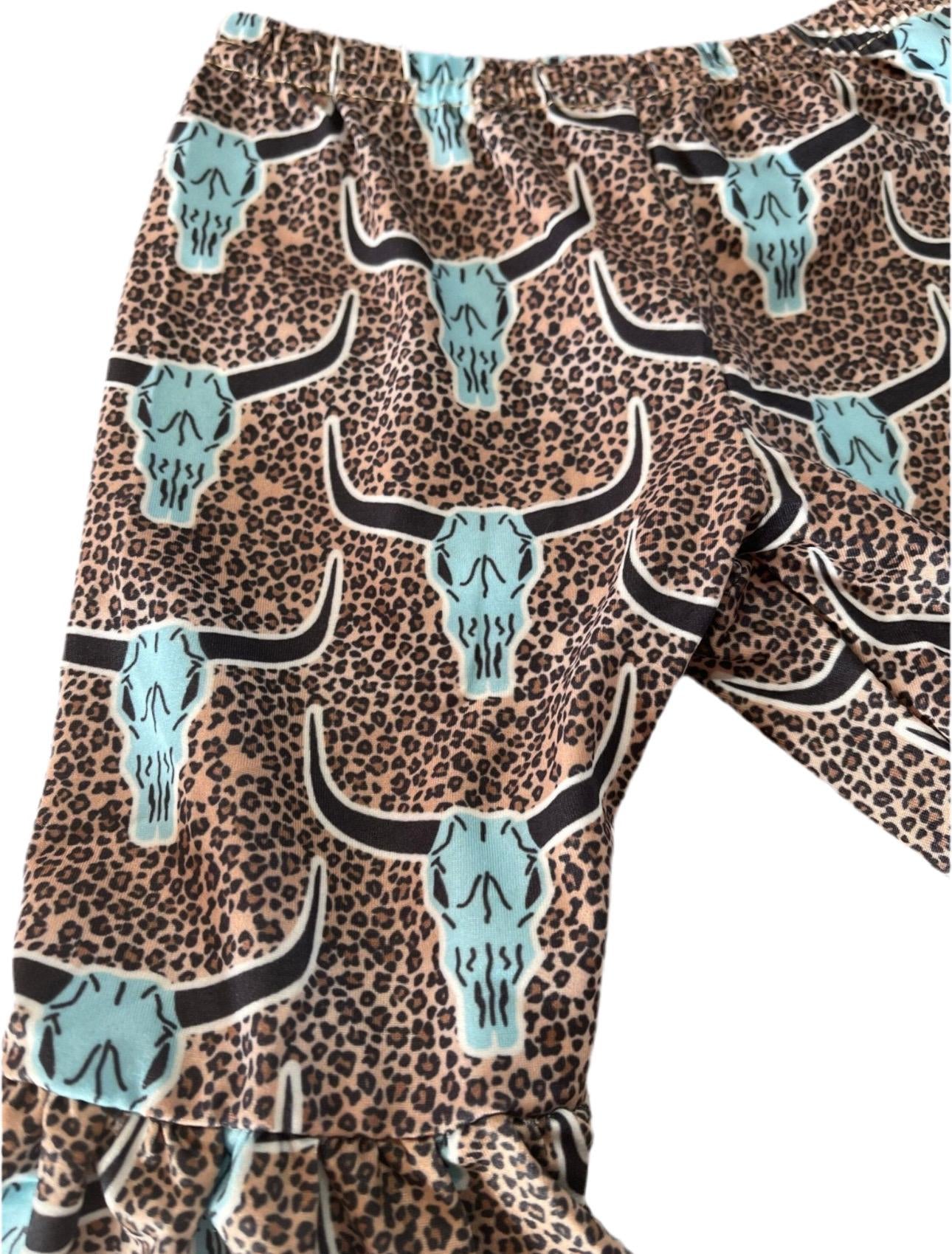 Saddle Up Buttercup! Girls Bell Bottom Outfit, Cowgirl Outfit, Turquoise T-Shirt & Cow Skull Cheetah Print Flares. Featuring a vibrant turquoise t-shirt and flared cow skull cheetah print bell bottoms - a showstopper for any Western-loving girl.