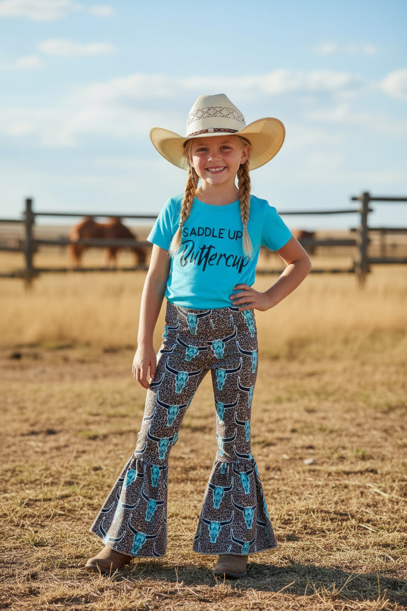 🔥 CLOSEOUT – ONLY $10! 🔥
Sizes: 8/9, 10/12, 14/16
Let her Saddle Up, Buttercup in this bold and sassy Western outfit for girls! Featuring a vibrant turquoise t-shirt with “Saddle Up Buttercup” across the front and matching cow skull cheetah print bell bottoms, this set is perfect for your little cowgirl’s next adventure.
✔ True to Size for a comfy, flattering fit
✔ Soft & Stretchy cotton/spandex blend
✔ Easy Care – machine wash & dry 🧺
✔ Fast Shipping – Ships same-day from Montana!