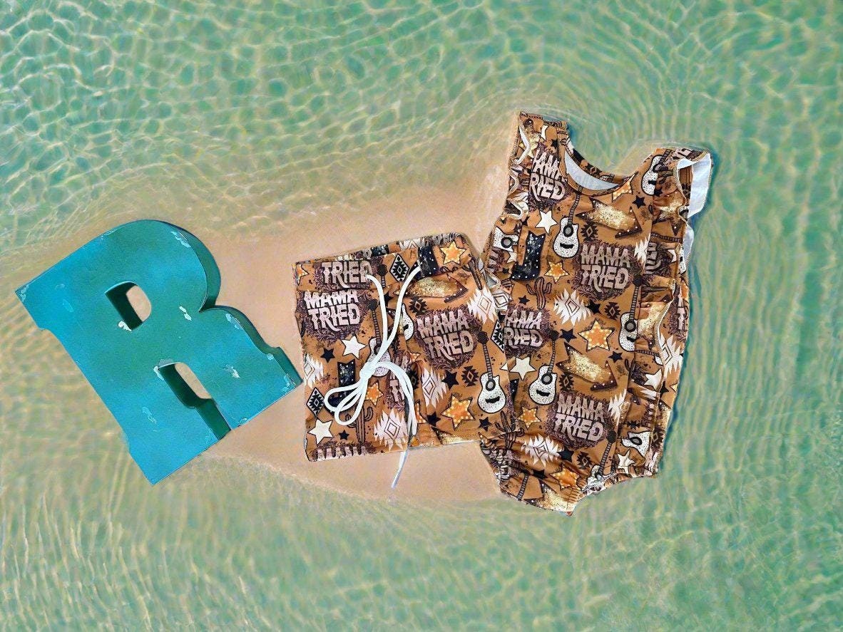 High quality, matching WESTERN swimsuits for kids, featuring Mama Tried print with allover Mama Tried, Cacti, Arrows, Stars and Guitars in a country brown. Sibling Swimwear is available in boys swim trunks and girls ruffle bathing suit.