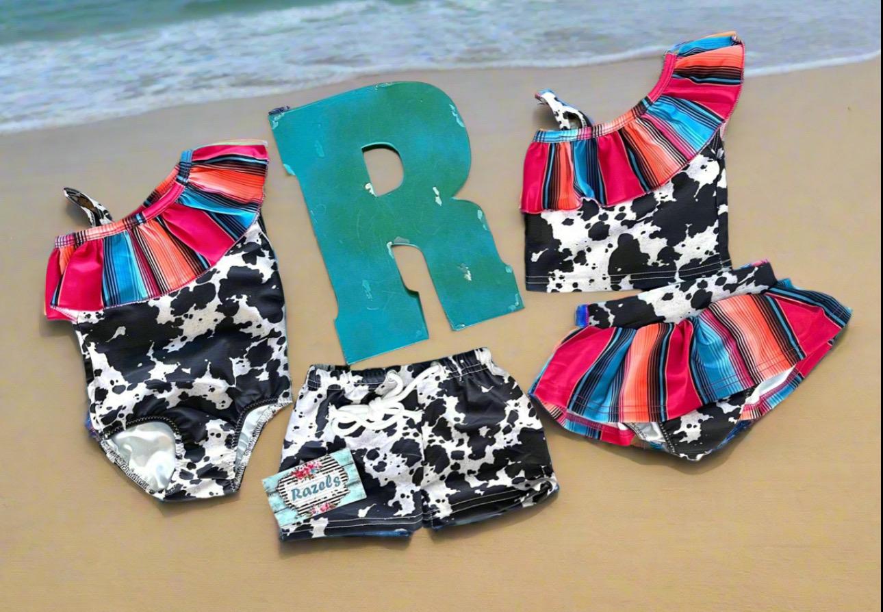 Family Matching Swimsuits, Serape, and Cowprint 1 piece 2 piece swimsuits and boys black and white cow print trunks