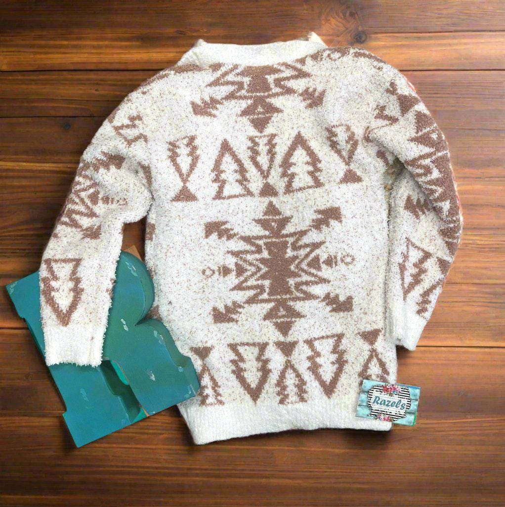 Girls Cozy Western Cardigan Sweater, A beautiful Cream sweater with tan southwestern aztec designs. A super soft sweater with big pockets and perfect for Fall.