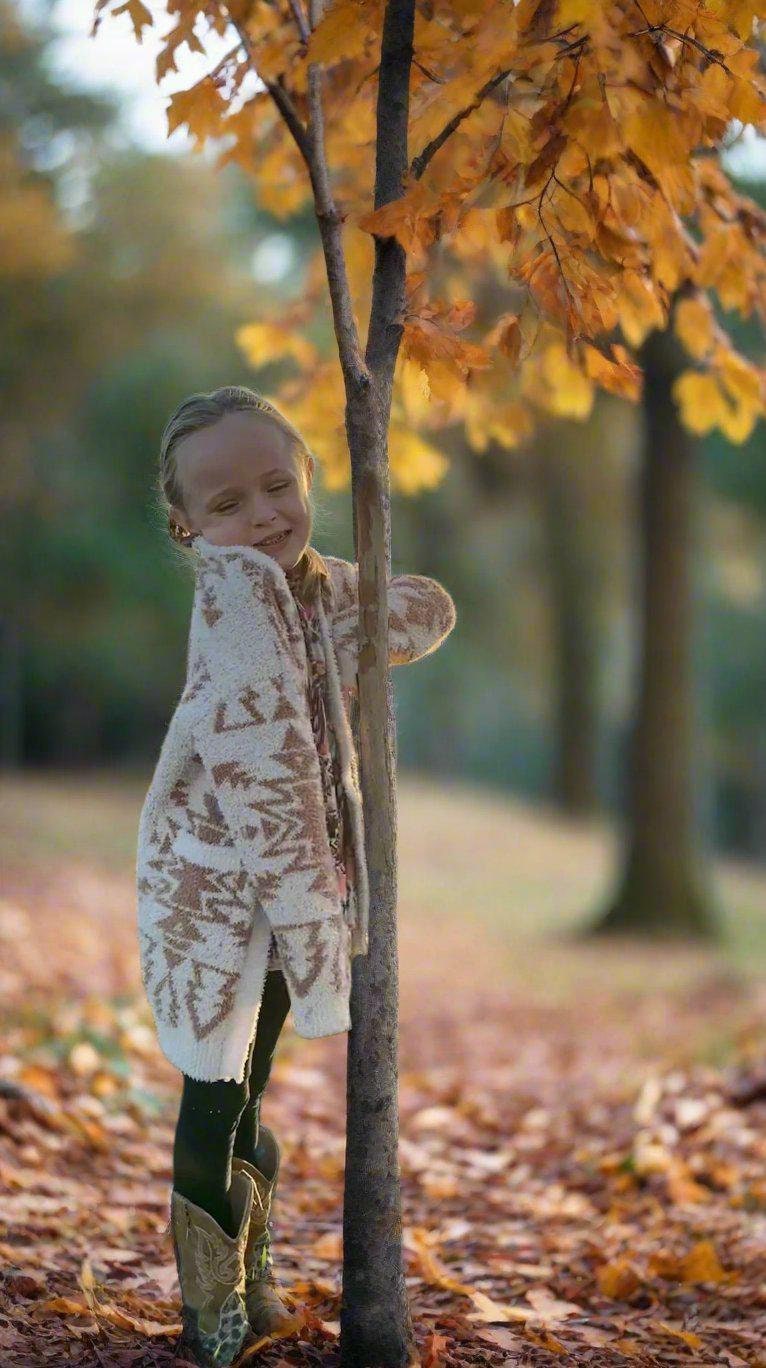 Girls Cozy Western Cardigan Sweater, A beautiful Cream sweater with tan southwestern aztec designs. A super soft sweater with big pockets and perfect for Fall.