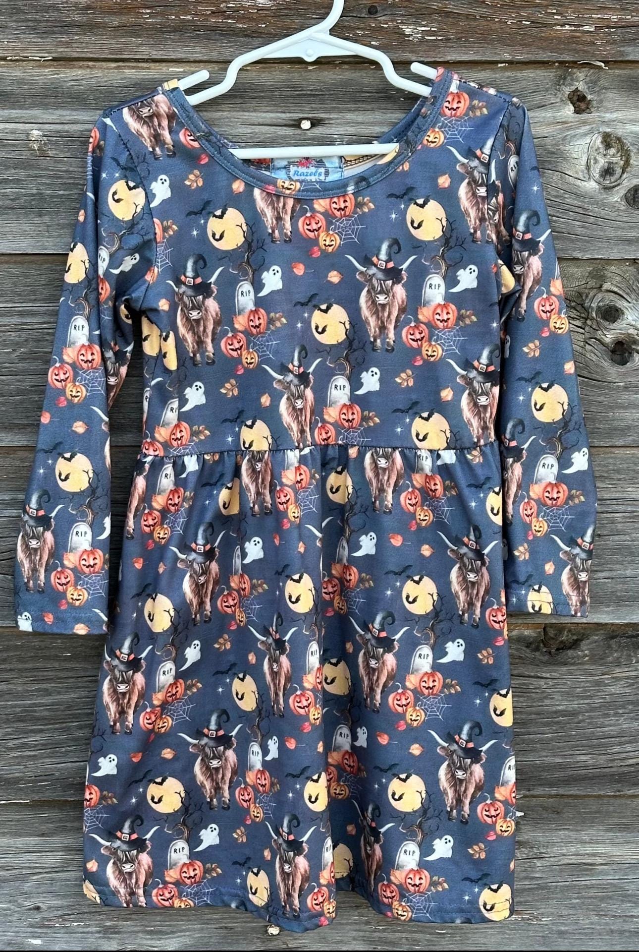 Highland Cow HALLOWEEN Dress: Western long-sleeve dress for girls featuring Highland cows in witches hats, bats, RIP graves stones, pumpkins, the full moon, spiderwebs, and more. Perfect all Fall.