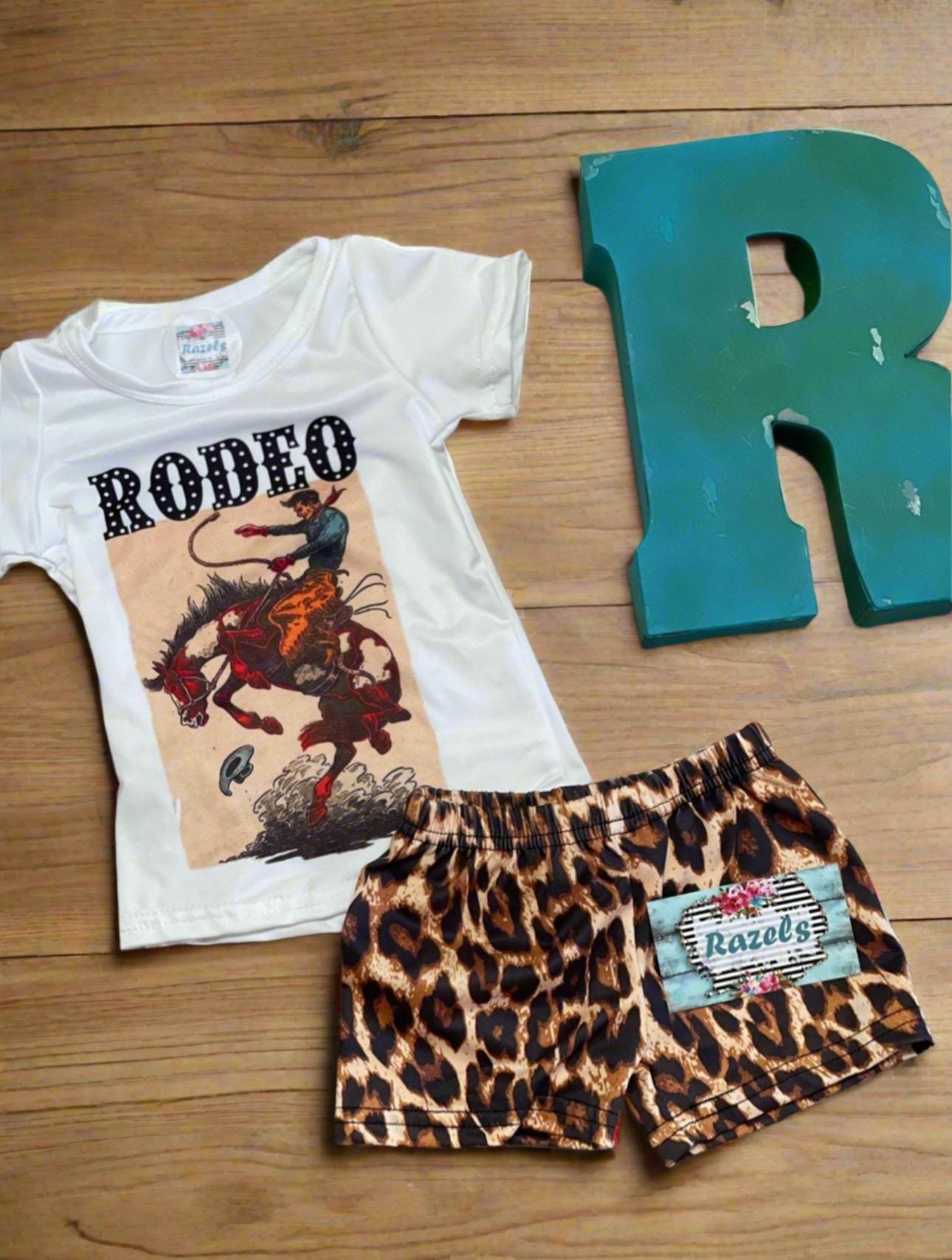 Fun Bucking Bronco Rodeo Outfit for Your Little Cowgirl! 🌟
Get your little one ready for adventure with our Western Rodeo Cowboy Short Set! This adorable outfit features a playful bucking bronco design, shorts boast a trendy cheetah print