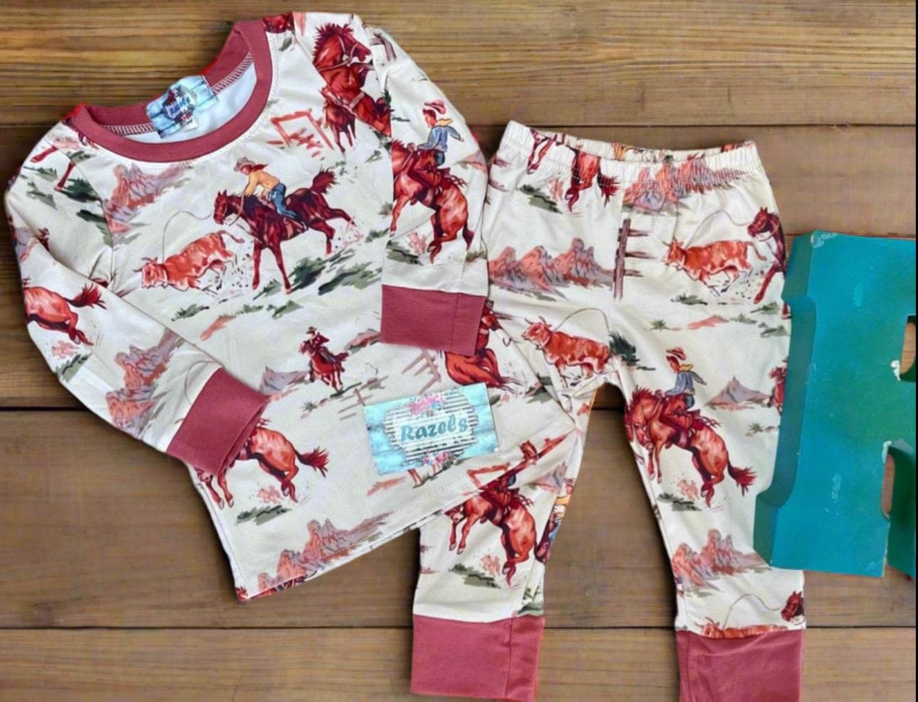 Saddle up with our exclusive Cowboy Pajamas featuring retro bucking broncs, roping steers, and steer wrestling! They’re comfy, stretchy, and true to size. Perfect for little wranglers and the whole family! Shop Razels for matching Western family PJs!