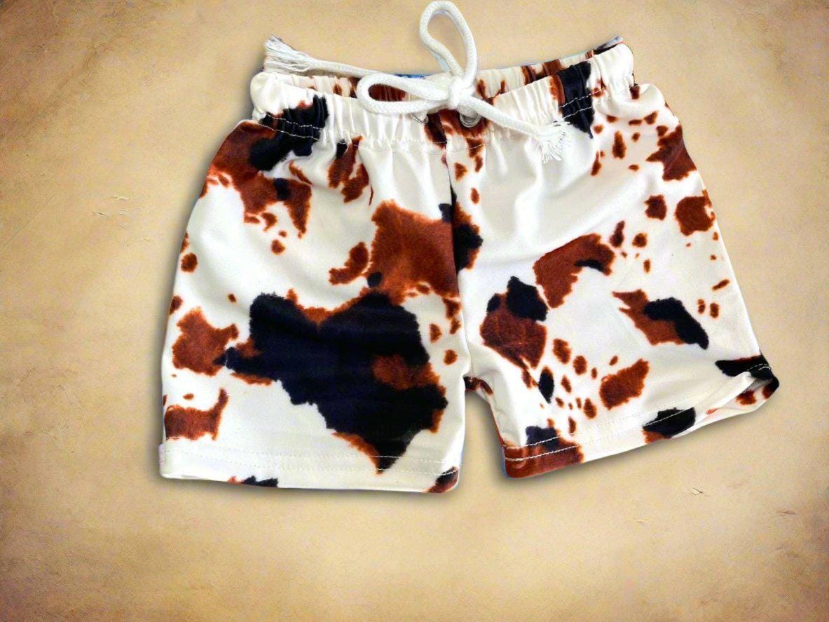 Cow Print Swim Suits are perfect for little cowboys and cowgirls!  Available Styles: Cow Print One-Piece, 2-piece tankini, or boys&#39; Cowprint Shorts.Available in sizes 0-3 months to 8/9 years. Ship FREE with $35+ purchase.