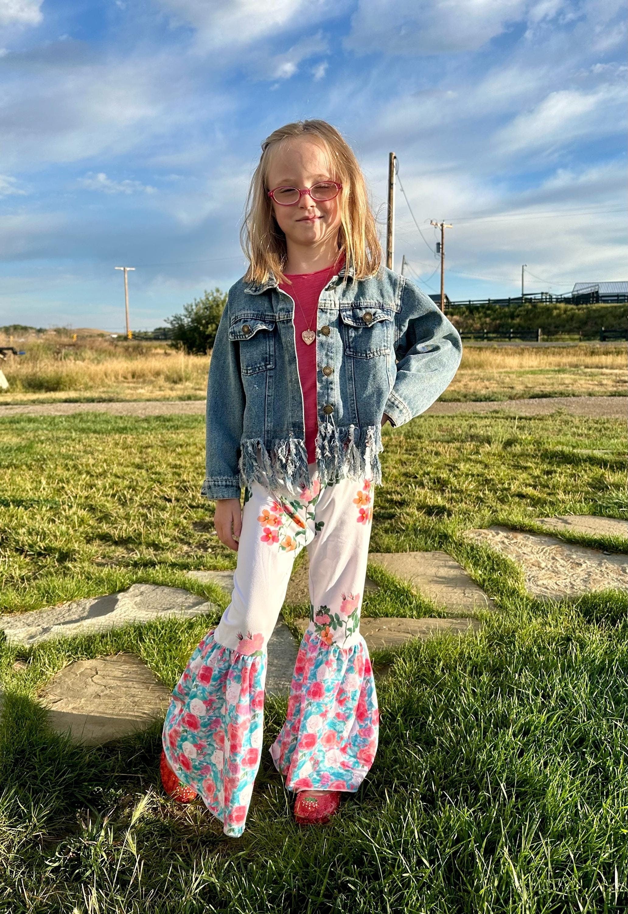 Floral Bell Bottoms designed with vibrant flower patterns and fun, playful colors are made with high-quality materials that promise comfort and durability, ensuring they’ll be a favorite all season long. These Wildflower pants will not disappoint!