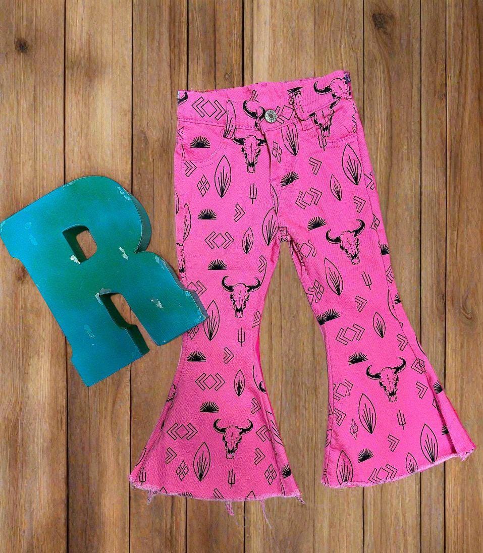 Jeans feature black steerheads, arrows, and cacti in an awesome western motif. Jeans have an adjustable waistband, pockets, and a frayed bell bottom hem.
