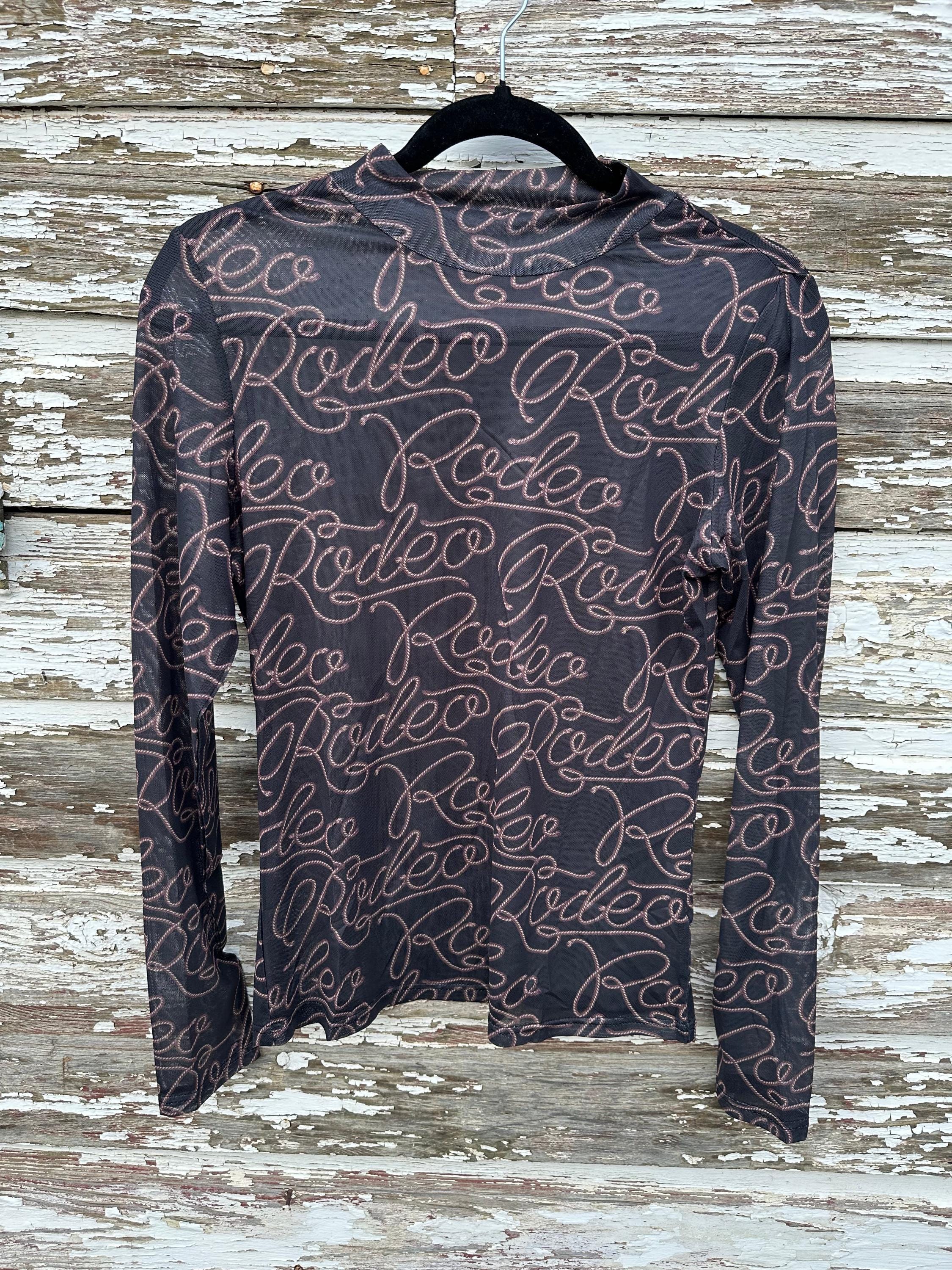 Turn heads with this Rodeo Black Mesh Western Shirt! Featuring sheer, breathable mesh and bold RODEO print, this Cowgirl Shirt is perfect for layering or rocking solo. A must-have Women’s Western Layering Sheer Shirt for rodeo nights or casual style!