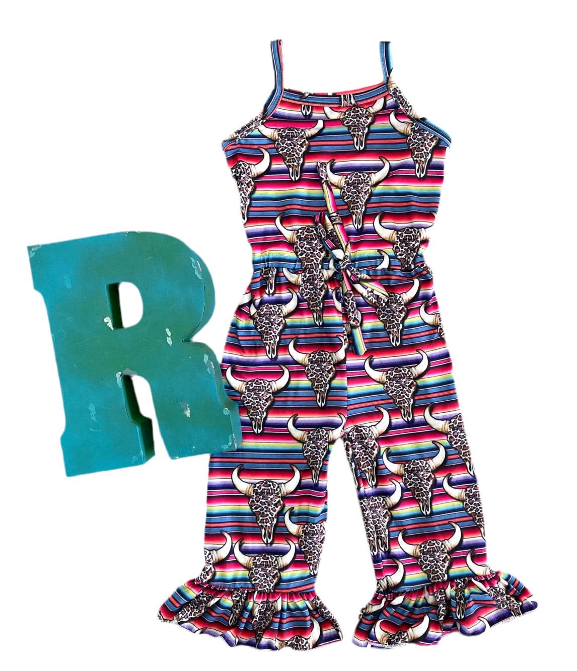 The Western Jumpsuit is here to steal the spotlight! 🤠😍 One of a kind and designed by me at Razels, this Cowgirl Outfit is an absolute showstopper with its charming design and flattering fit. The elastic waistband ensures all-day comfort, making this Serape Jumpsuit as practical as it is stylish.

How fun and Western fabulous is this Bell Bottom Romper? Featuring bold serape stripes, cow skulls, and cheetah print, it combines all the best Western elements into one stunning piece!