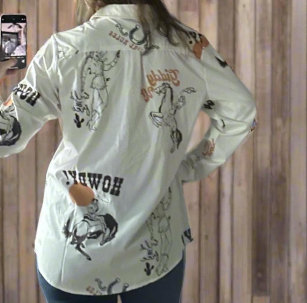 Women&#39;s off-white long-sleeved Western button-up shirt featuring &#39;Cowgirl Rules,&#39; roping cowgirls, howdy text, and horseshoes. Perfect Fall blouse for layering with jeggings and other seasonal styles