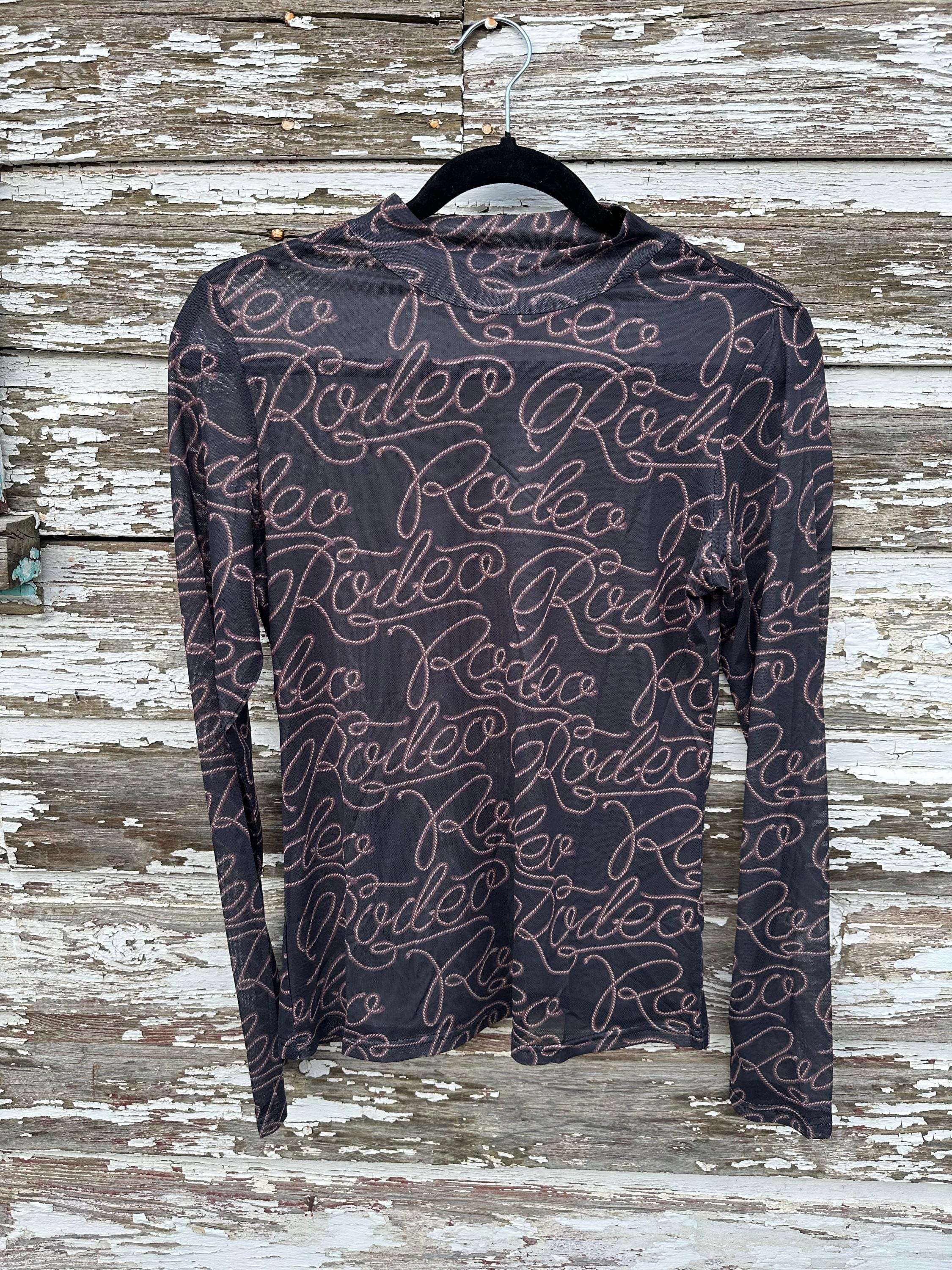 Turn heads with this Rodeo Black Mesh Western Shirt! Featuring sheer, breathable mesh and bold RODEO print, this Cowgirl Shirt is perfect for layering or rocking solo. A must-have Women’s Western Layering Sheer Shirt for rodeo nights or casual style!