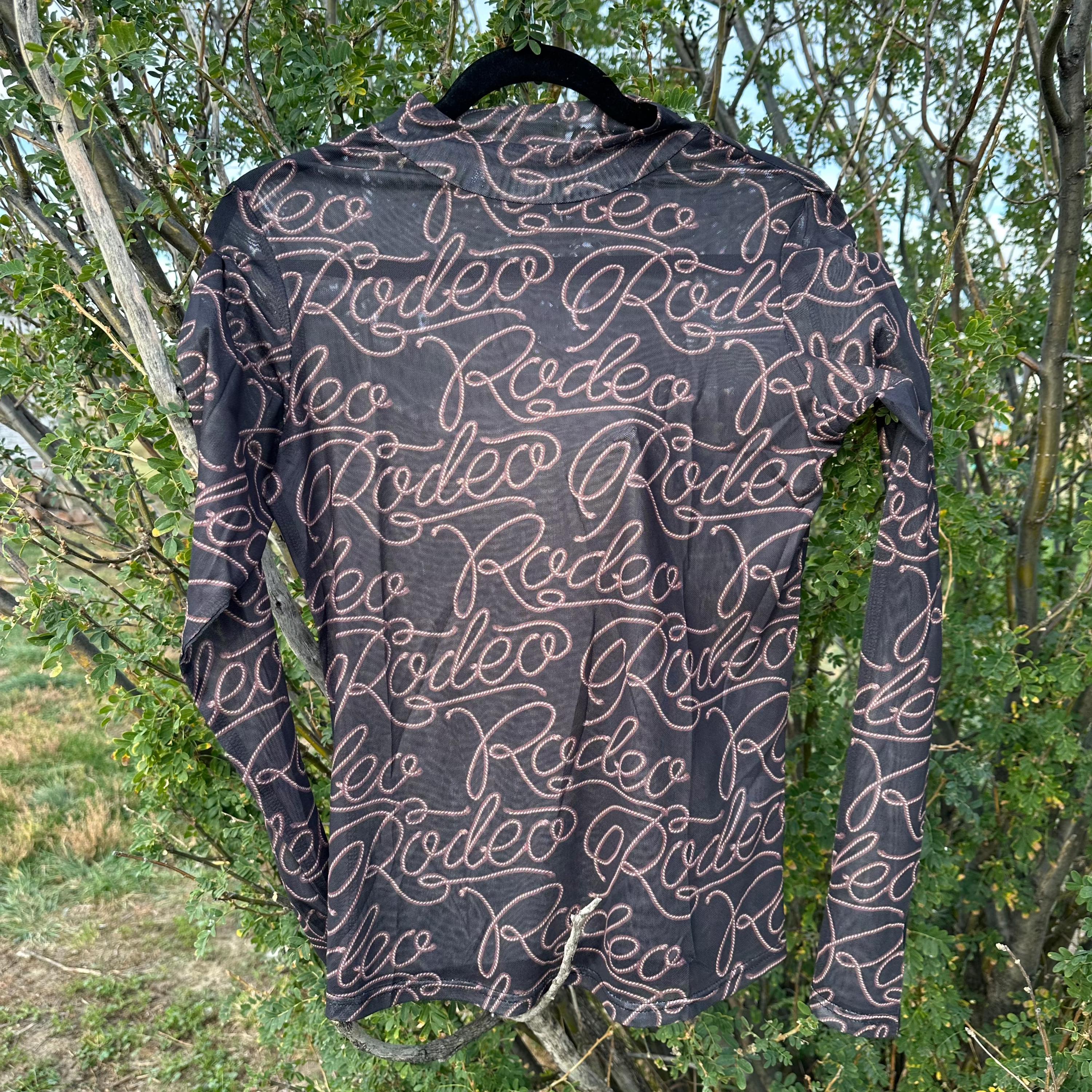 Rodeo Black Mesh Western Shirt for women, featuring breathable mesh fabric and a bold rodeo print. Long sleeves provide sun protection and comfort, making it perfect for layering or wearing alone. Ideal for stylish cowgirls on the go.