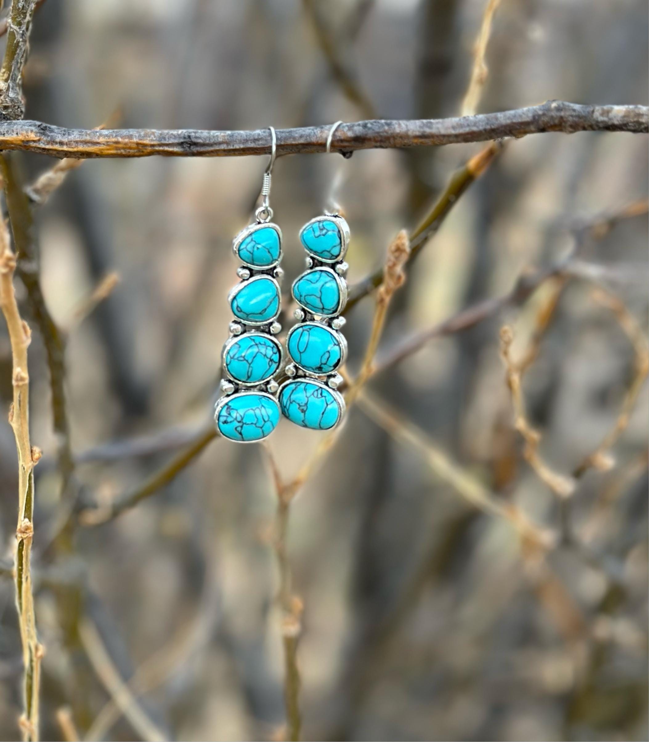 Cowgirl Style Turquoise Stacked Dangle Earrings. Featuring a unique stacked design with four beautiful stones, these 2-inch dangles bring a bold, eye-catching style that’s perfect for any cowgirl at heart. Great Christmas gift for HER!