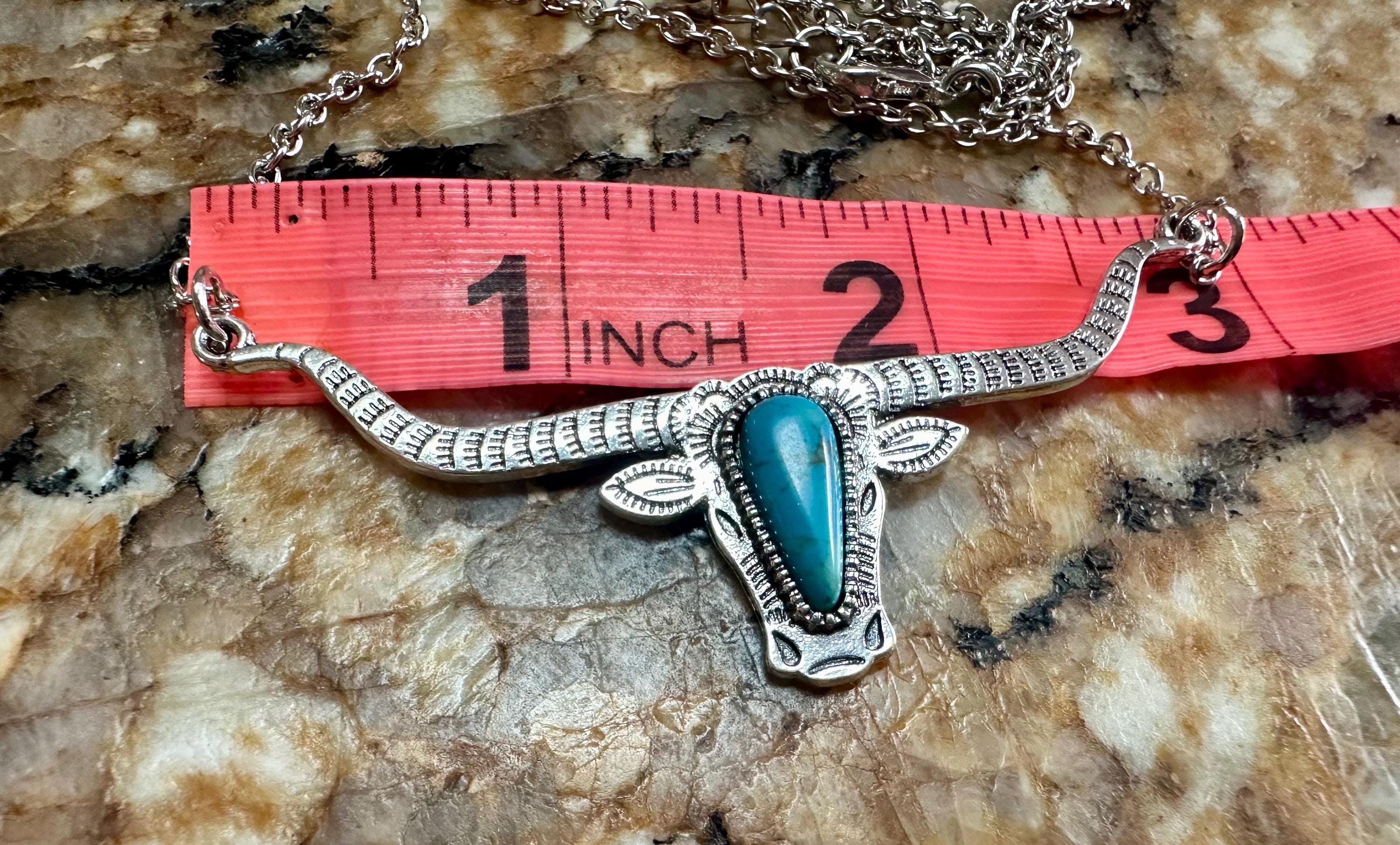 Bold and Beautiful: Split Chain Longhorn Necklace with Turquoise Stone. Embrace a bold, Western style with our stunning Split Chain Longhorn Necklace—designed for those who truly & grab life by the horns. Ships FREE with $35+ purchase