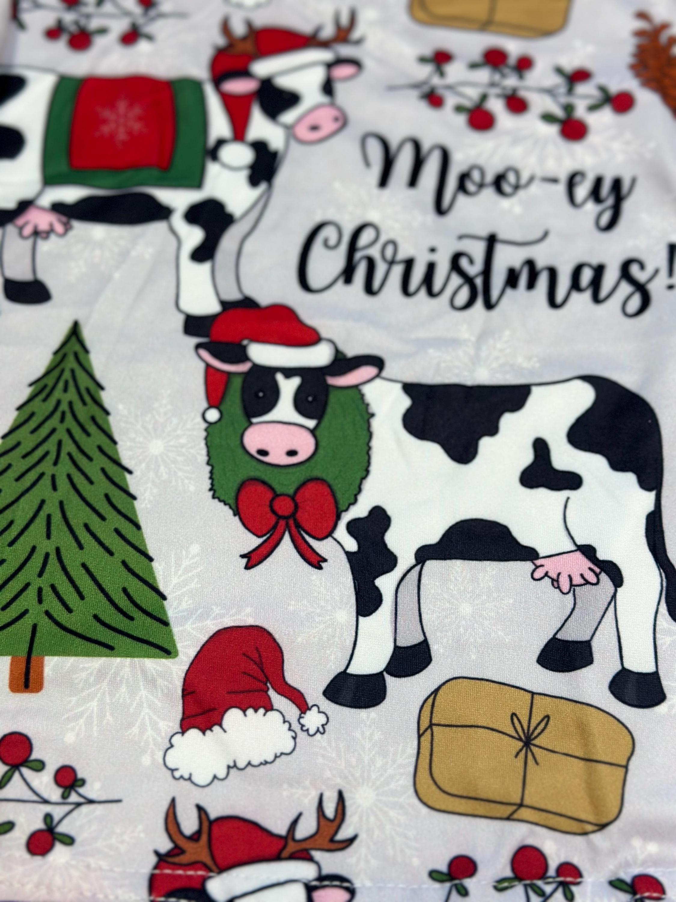 Moo-ey Christmas Pajamas, kids Holstein Cow Christmas pajamas featuring adorable cows wearing Santa Hats, antlers, surrounded by Christmas Trees, pinecones, presents. Farm Kid Pajamas