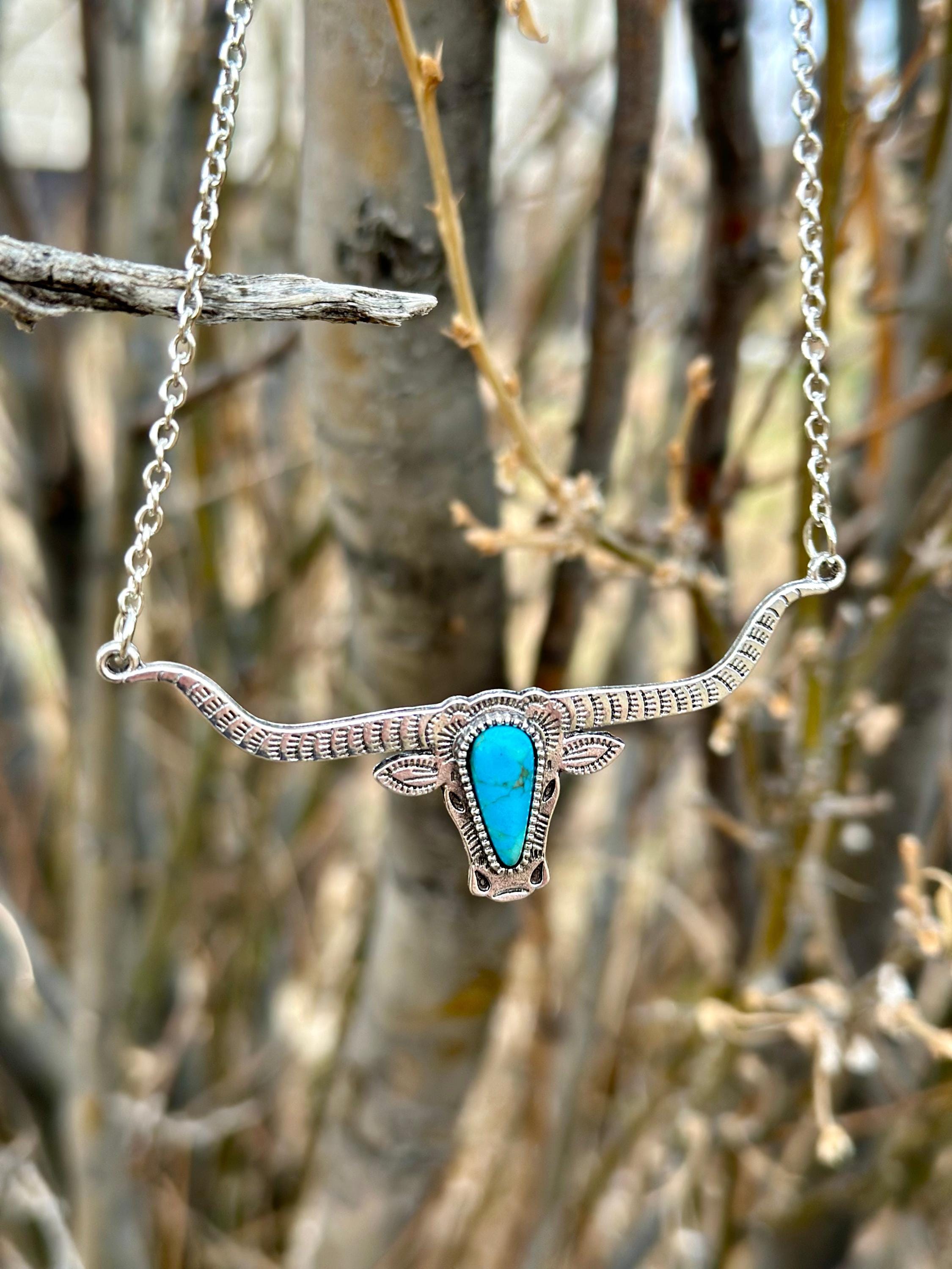 Bold and Beautiful: Split Chain Longhorn Necklace with Turquoise Stone. Embrace a bold, Western style with our stunning Split Chain Longhorn Necklace—designed for those who truly & grab life by the horns. Ships FREE with $35+ purchase