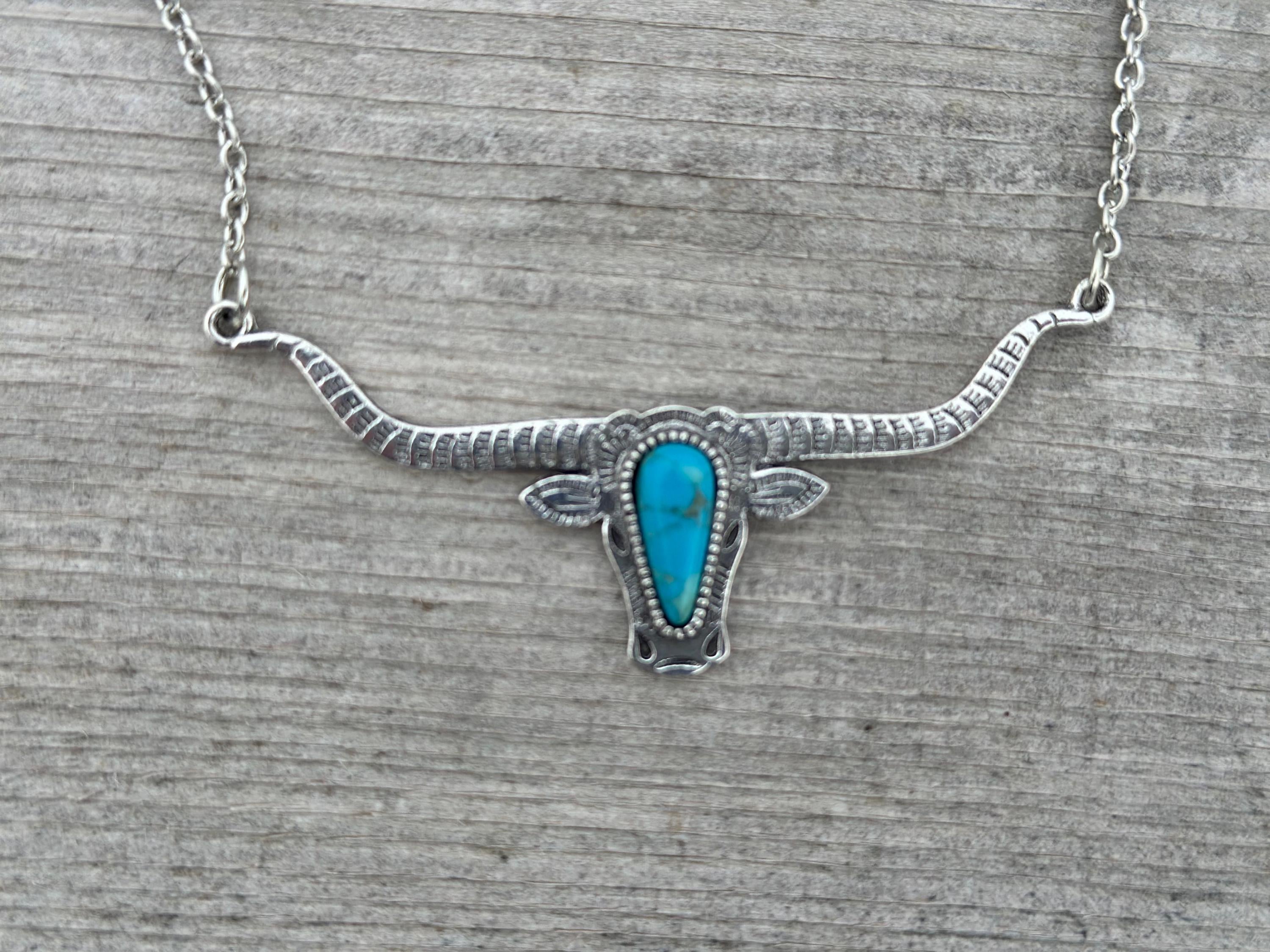 Bold and Beautiful: Split Chain Longhorn Necklace with Turquoise Stone. Embrace a bold, Western style with our stunning Split Chain Longhorn Necklace—designed for those who truly & grab life by the horns. Ships FREE with $35+ purchase